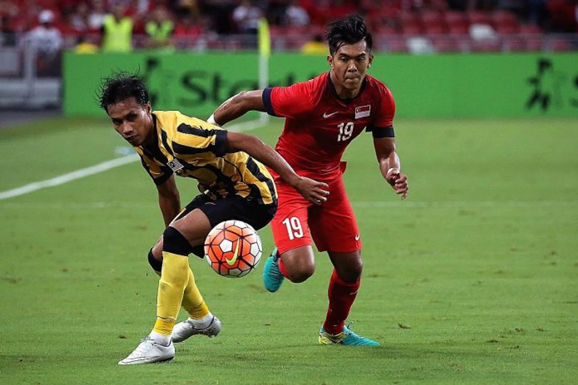FIGHTING DISPLAY: Lions Khairul Amri (near left) and Faritz Hameed (right) giving the fans at the National Stadium much to cheer despite the 0-0 draw.