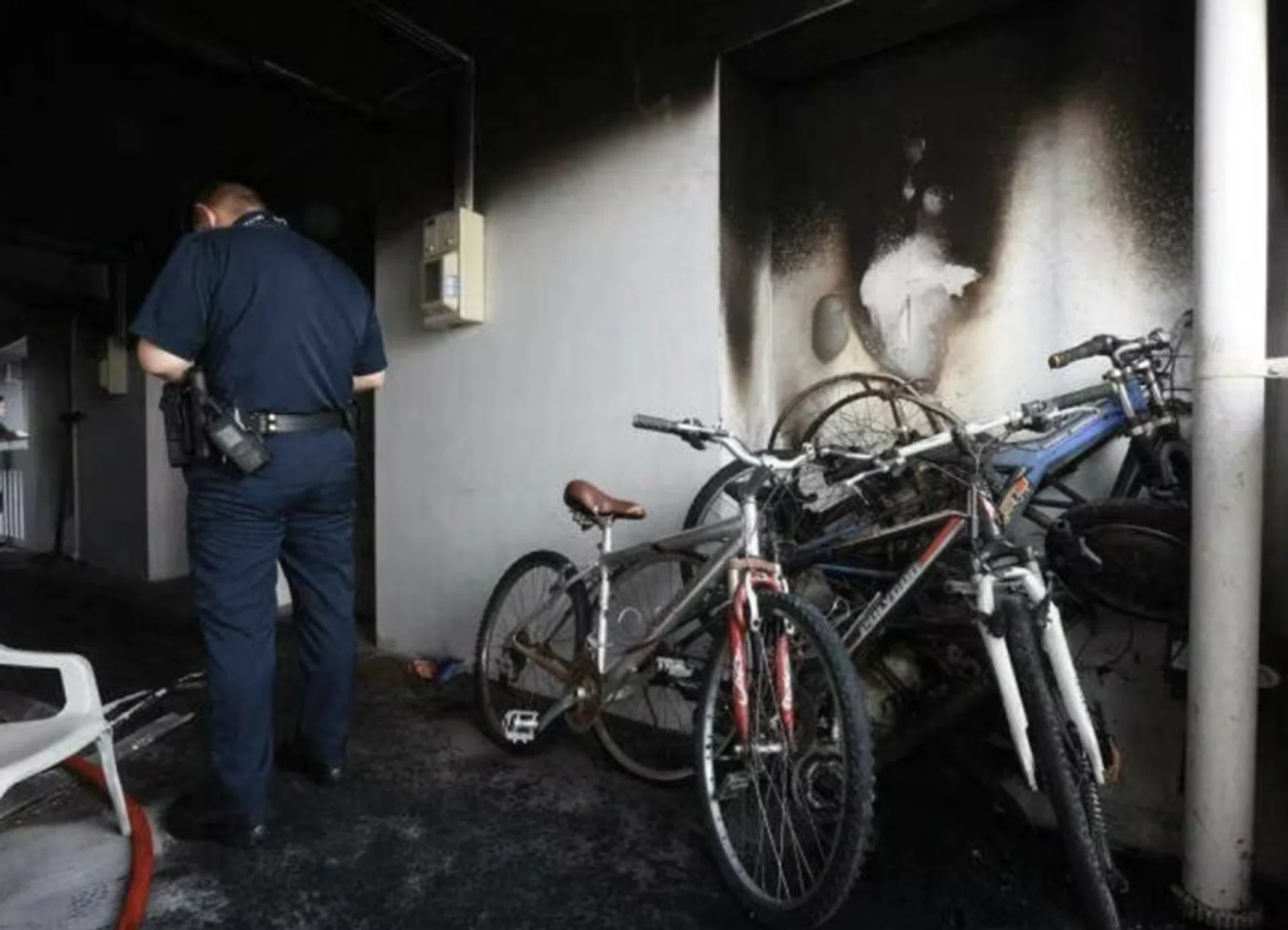 The blackened walls and ceiling of the corridor where the fire broke out.