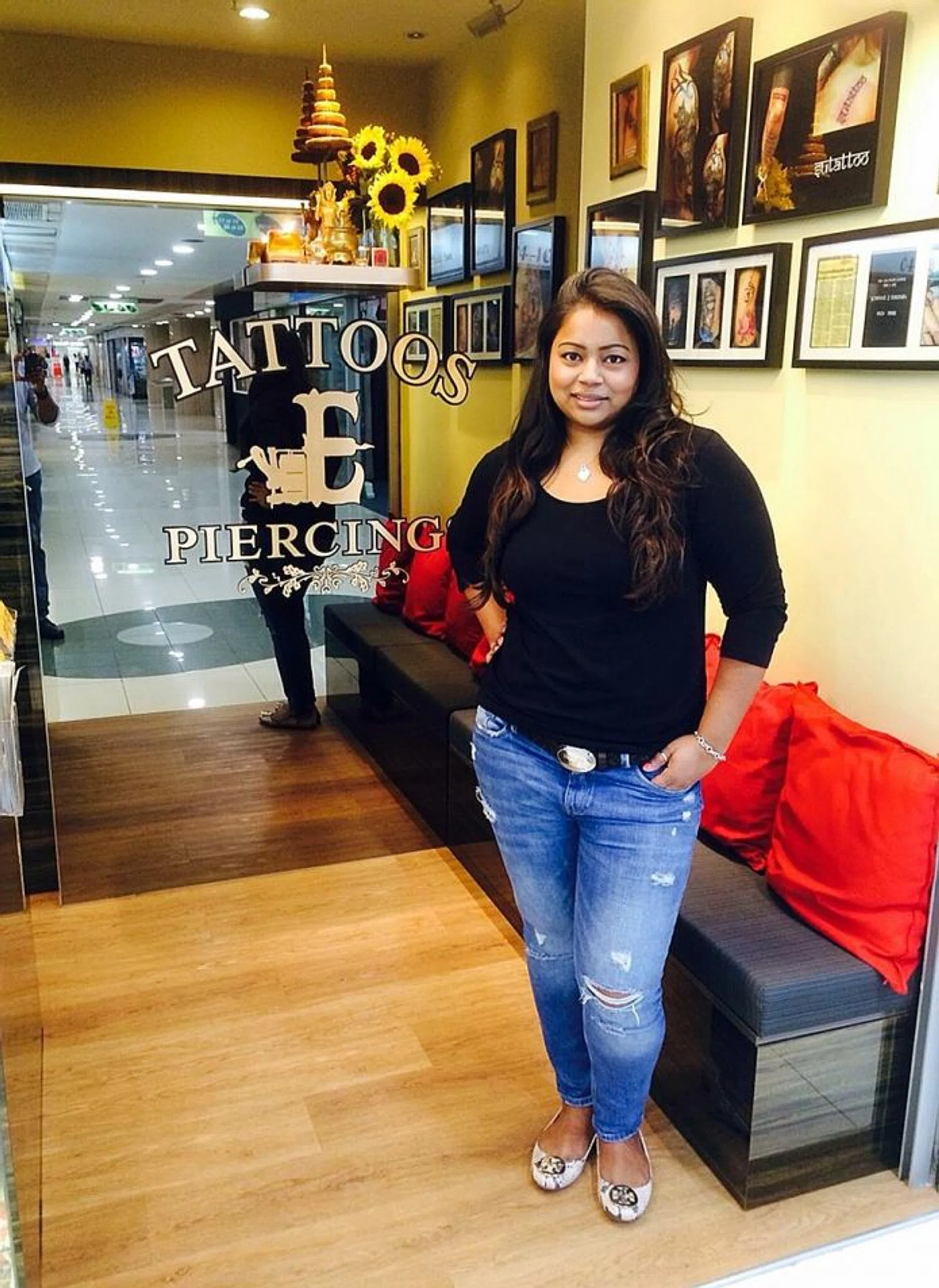 INK ARTIST: Miss Sumithra Debi, granddaughter of the late tattoo artist Johnny Two Thumbs, is the owner of Exotic Tattoos and Piercings.