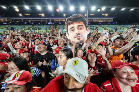 Ferrari fans gathering on the track after the Formula 1 Singapore Airlines Singapore Grand Prix night race at the Marina Bay Street Circuit on Oct 5.