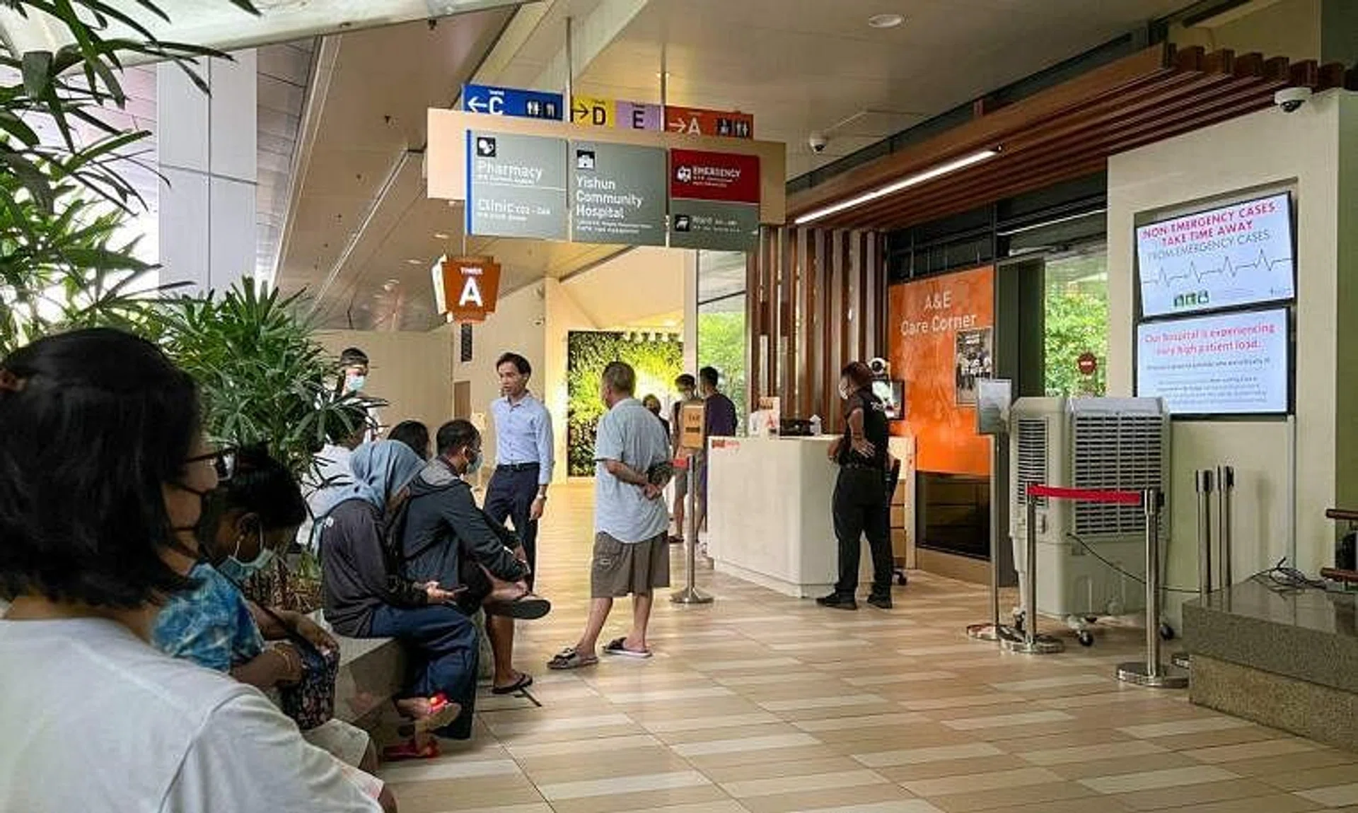 People waiting outside Khoo Teck Puat Hospital’s emergency department on April 20.