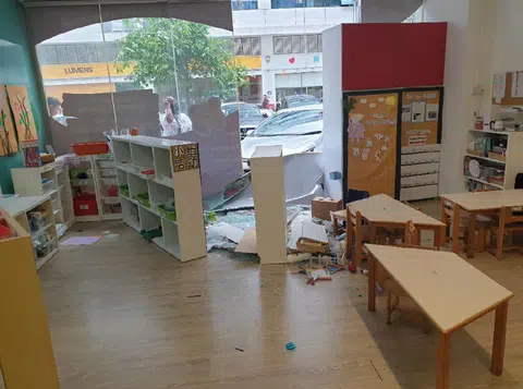The car crashed into the glass wall of the pre-school and shattered one of the panels completely.