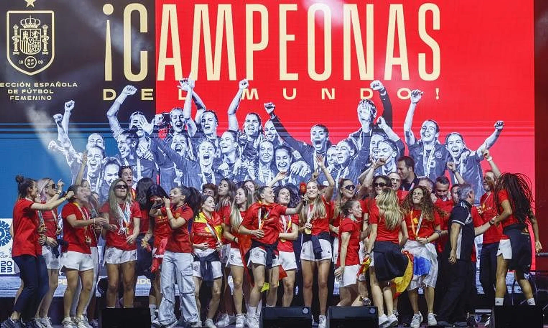 Spain's players dancing on stage in Madrid as they celebrate with supporters after winning the Women's World Cup.