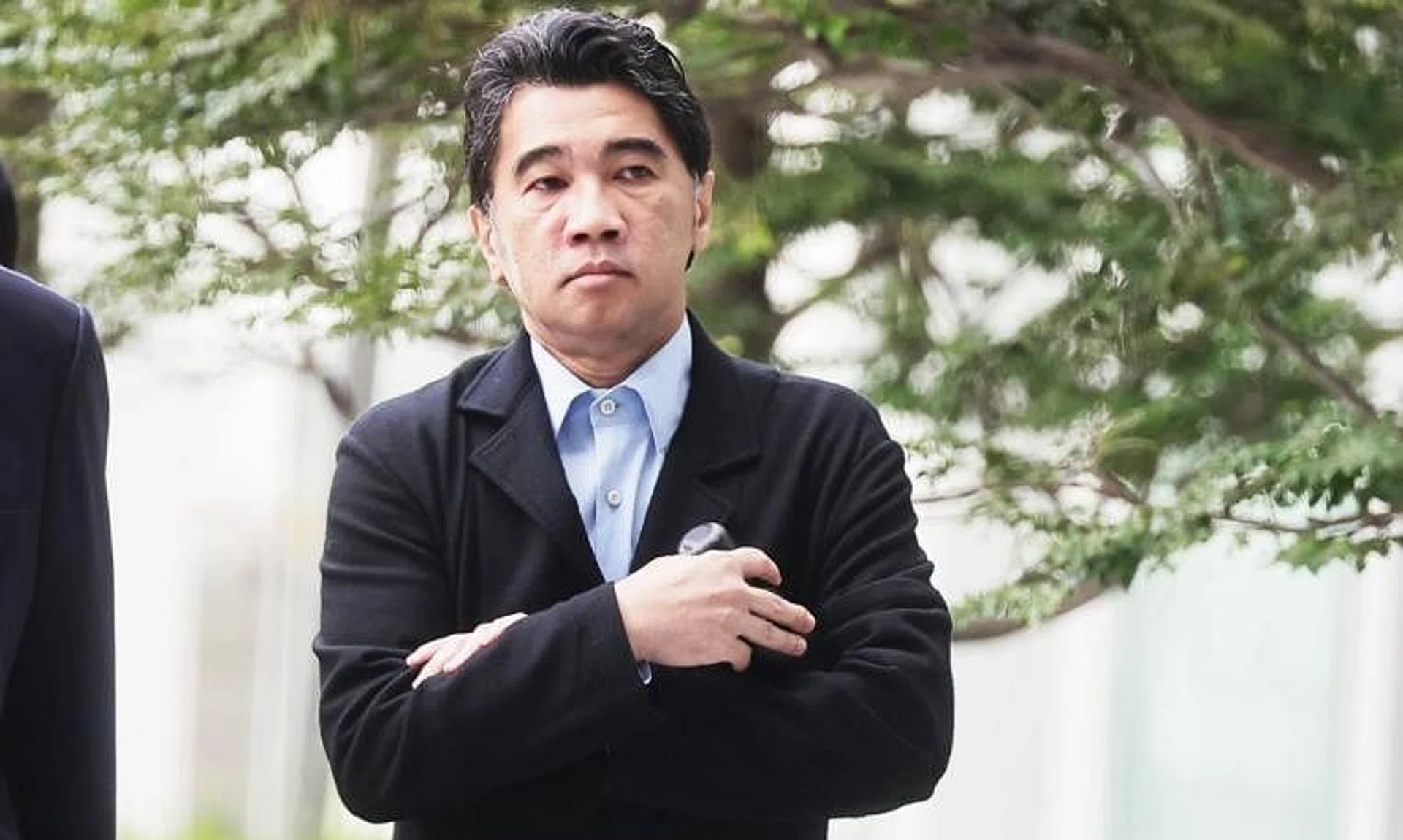 Former Singapore Idol judge Ken Lim arriving at State Courts on May 6.