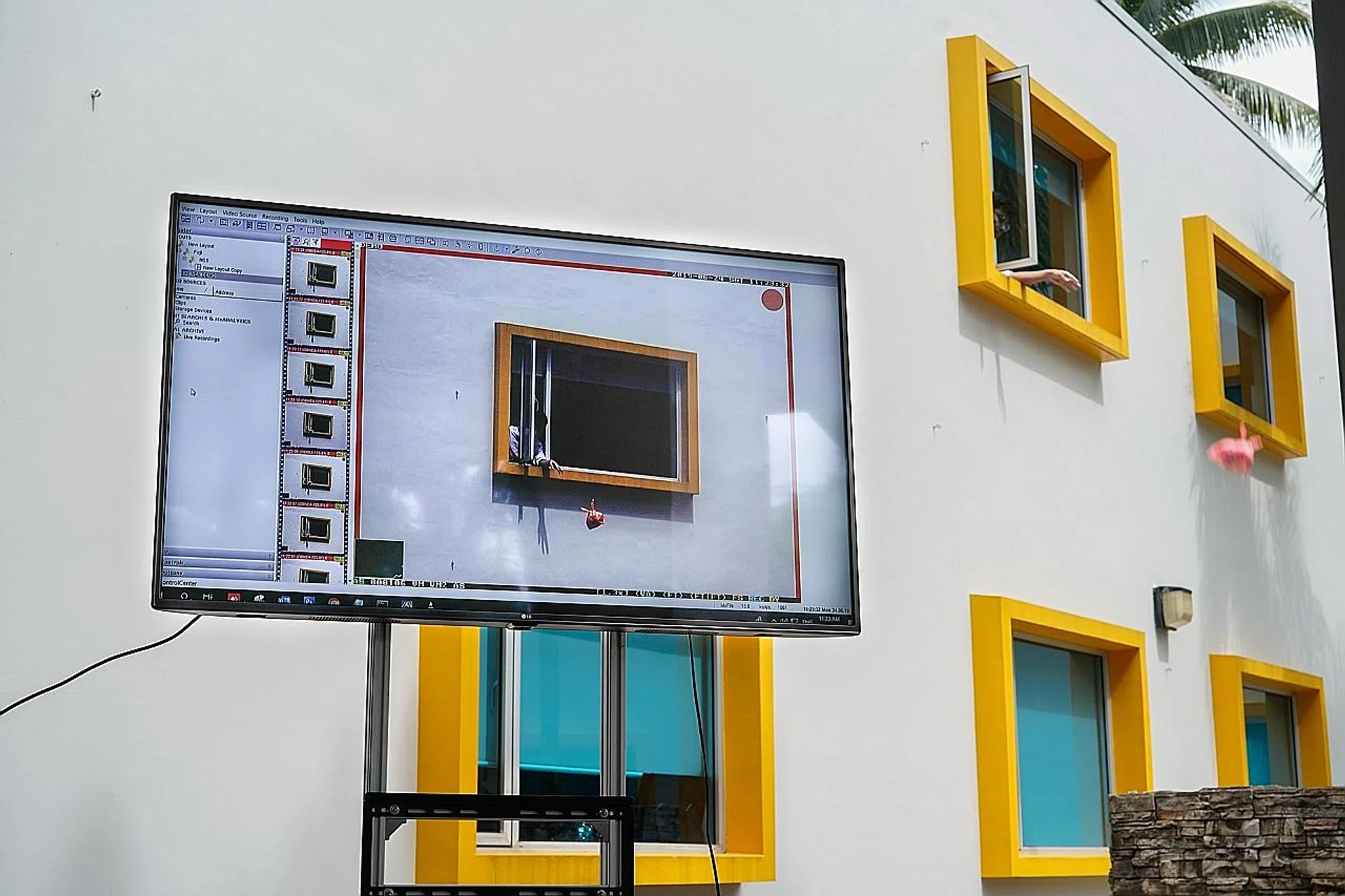 A demonstration of how NEA's surveillance cameras capture someone throwing rubbish out. 