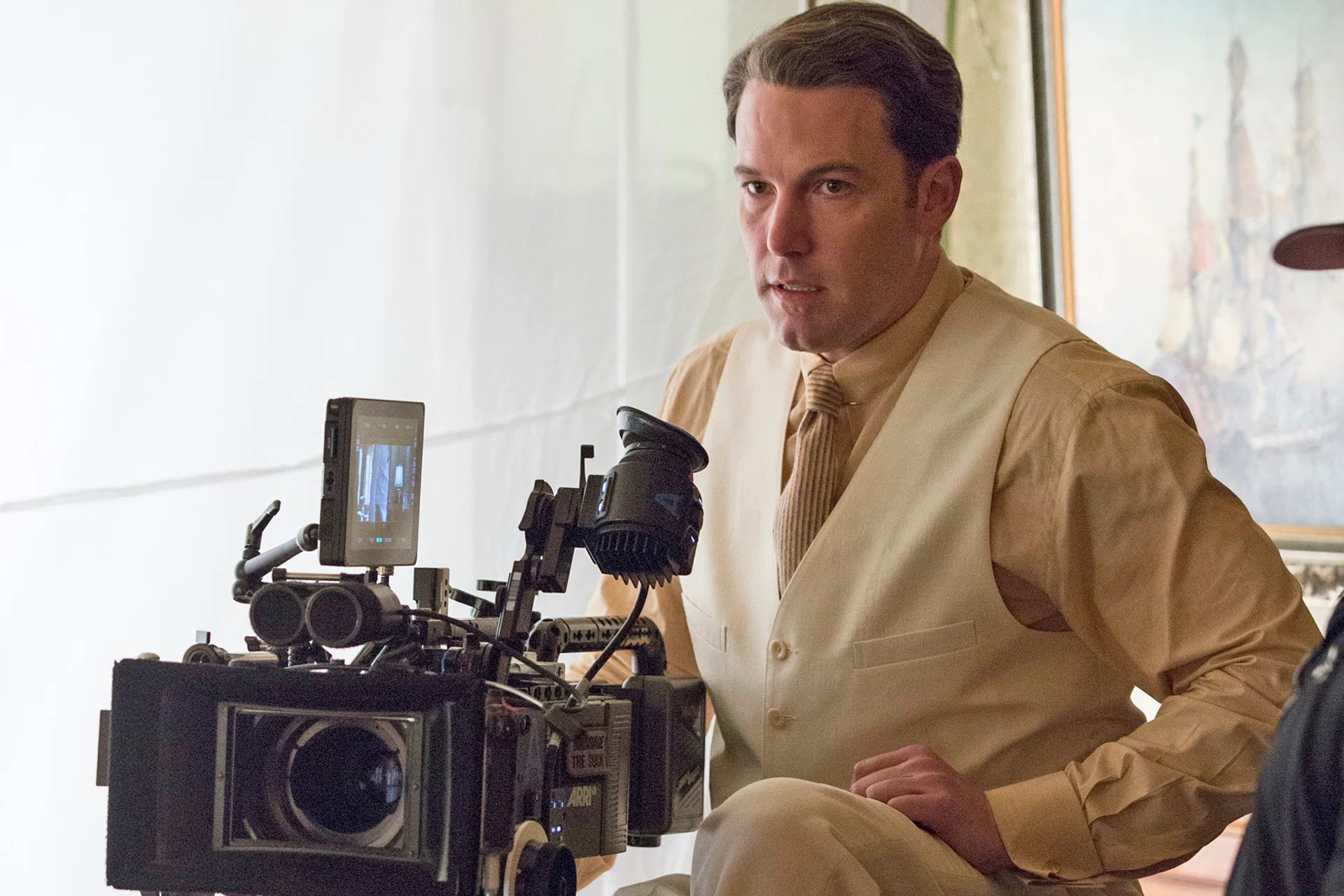 Ben Affleck directs (above) and plays the lead, a gangster called Joe Coughlin, in the movie Live By Night, which opens here tomorrow. 