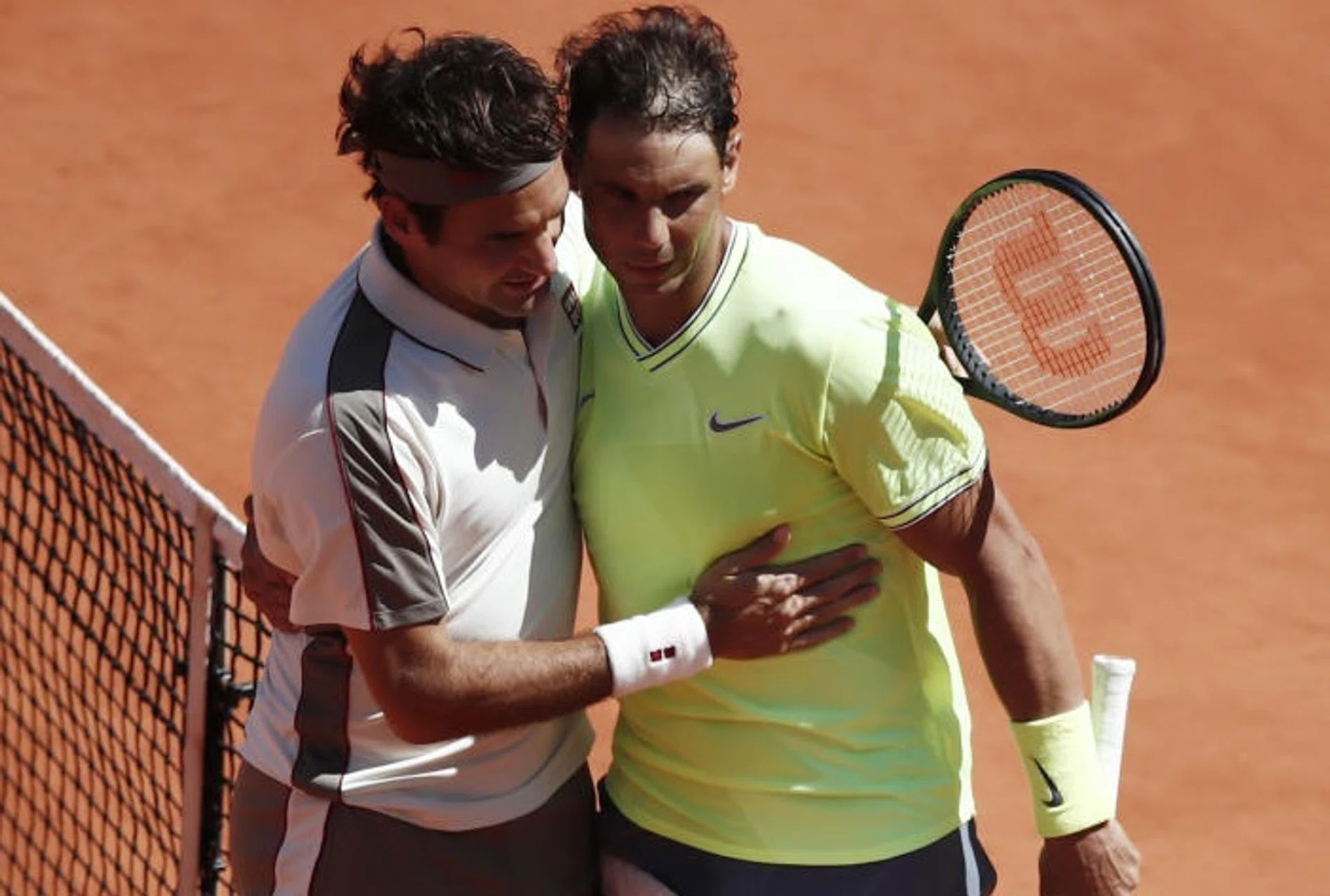 Rafael Nadal receives congratulations from Roger Federer after the French Open semi-final.