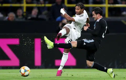 Depleted Germany squander two-goal lead to draw with Argentina