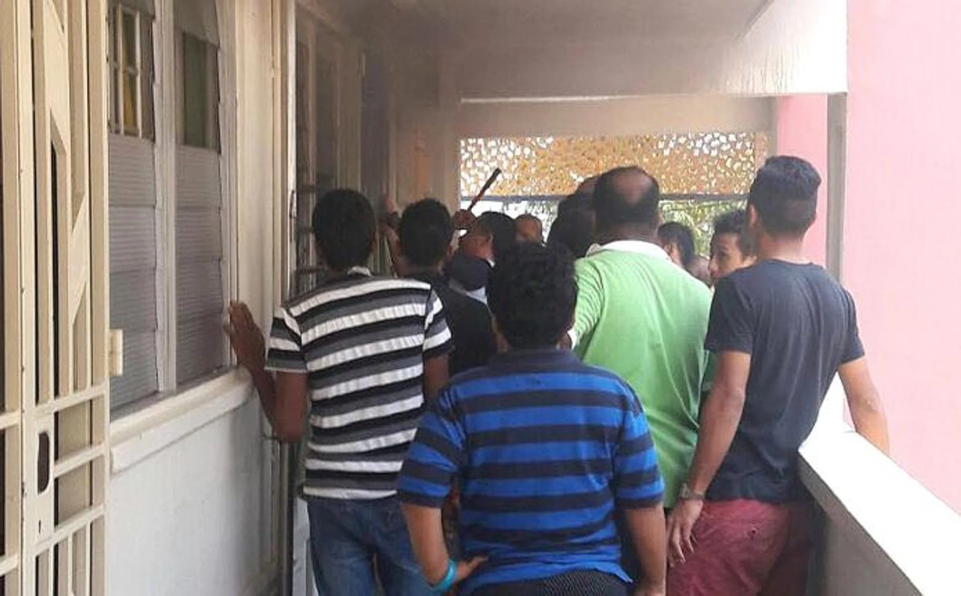 DRAMA:  More than 10 residents gathered outside the elderly man's flat to try to break into  his unit.