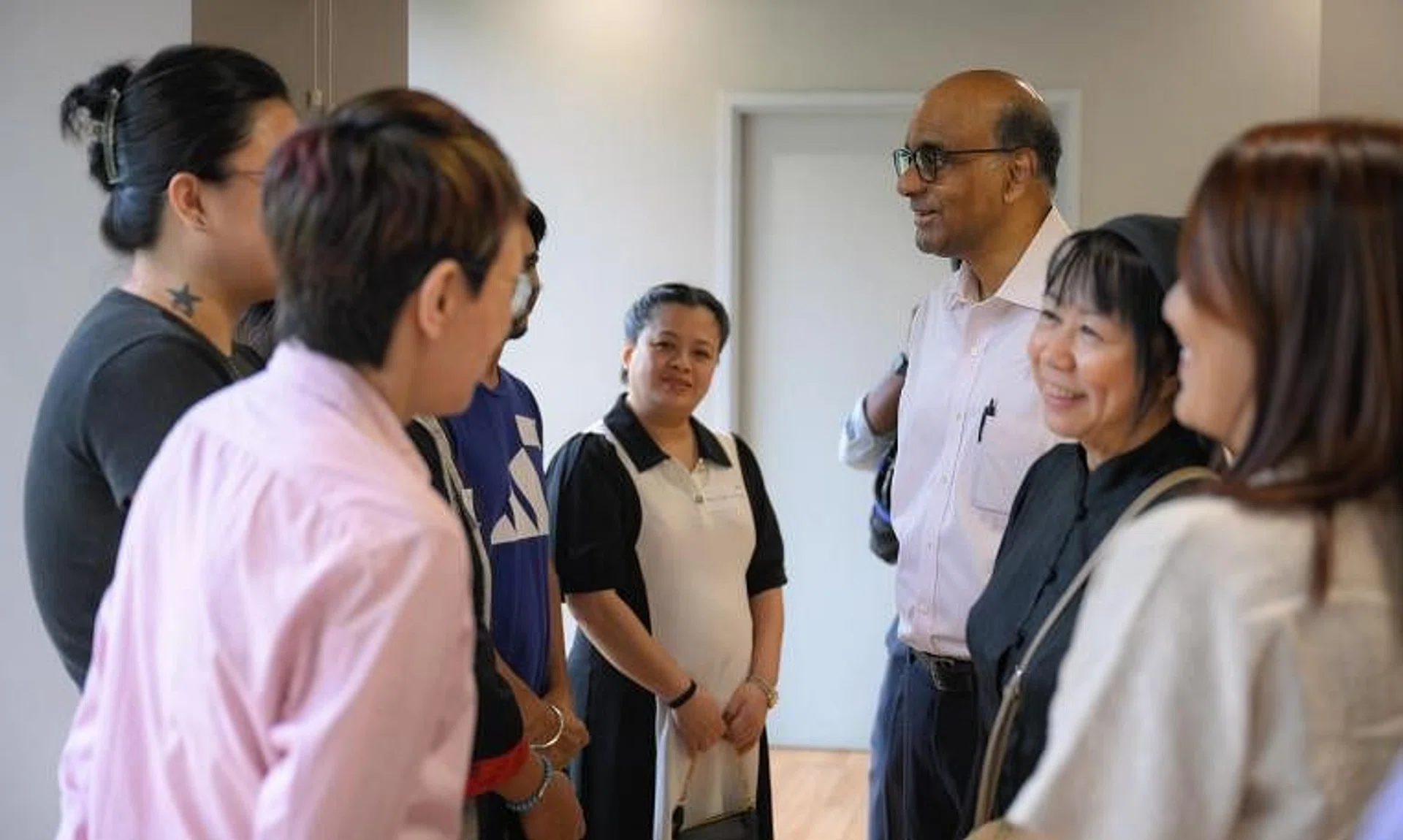 President Tharman Shanmugaratnam and his wife Jane Ittogi meeting guests and beneficiaries of AWWA's FEP on July 17.