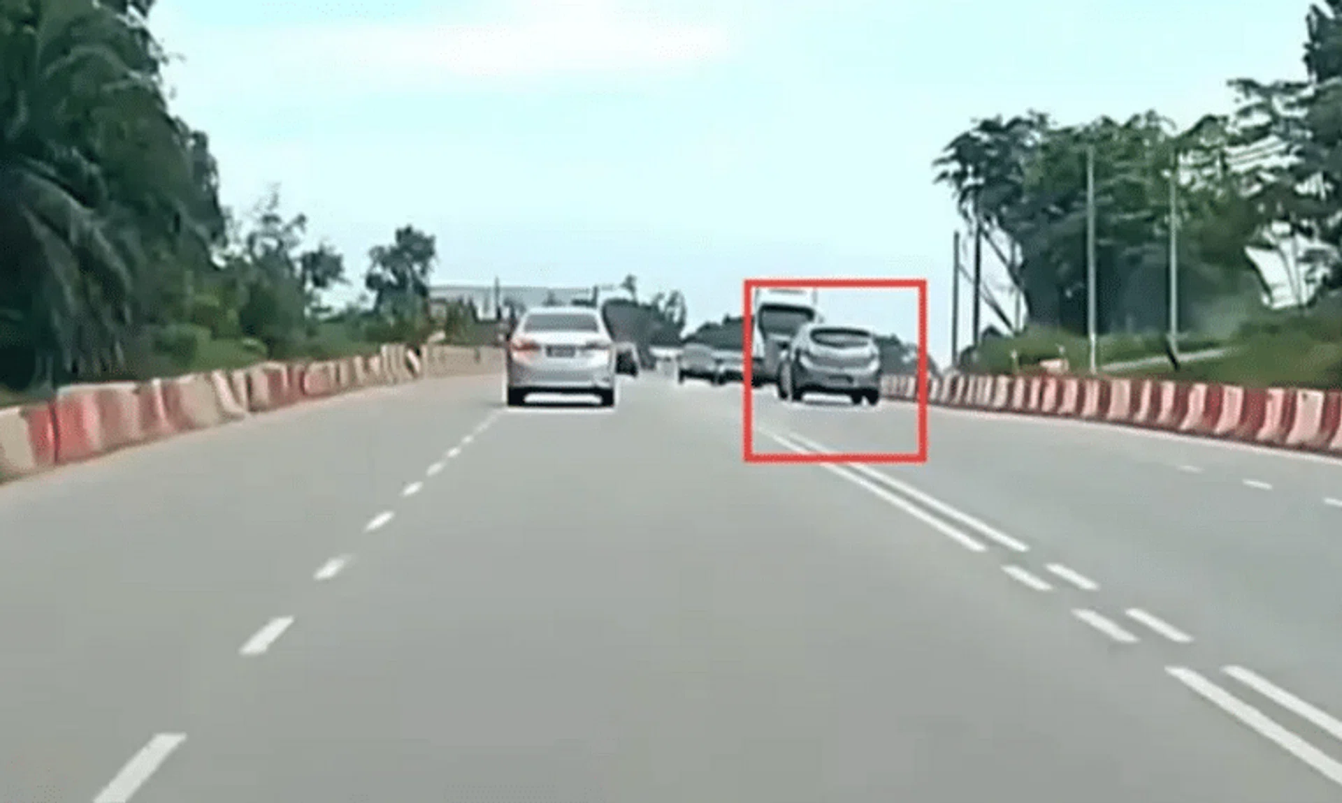 The vehicle can be seen driving along the opposite lane before swerving back into the correct lane as it nears other vehicles.