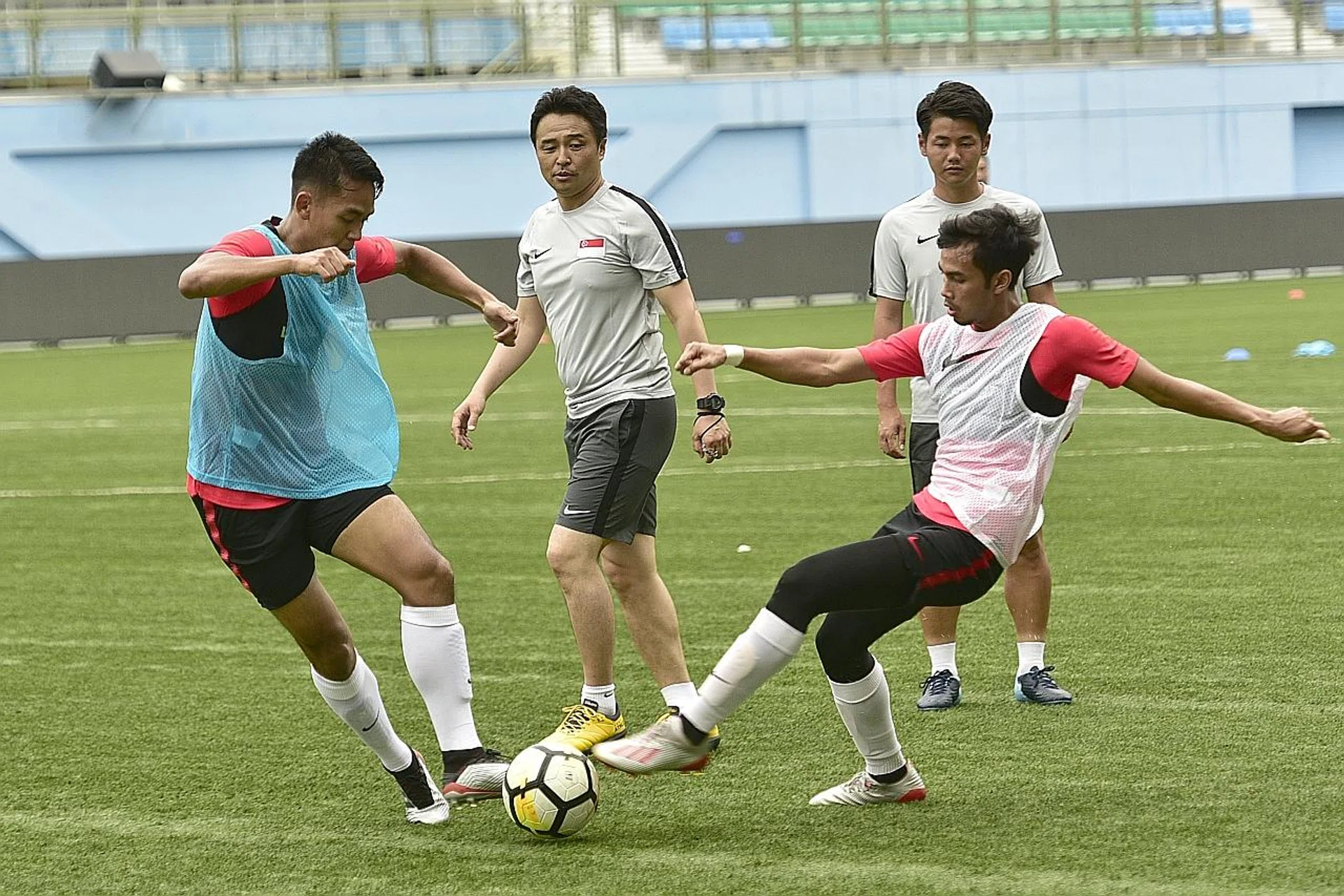 Coach Tatsuma Yoshida (centre) calls on fans' support to help Singapore progress to the next round of World Cup qualifiers. TNP FILE PHOTO