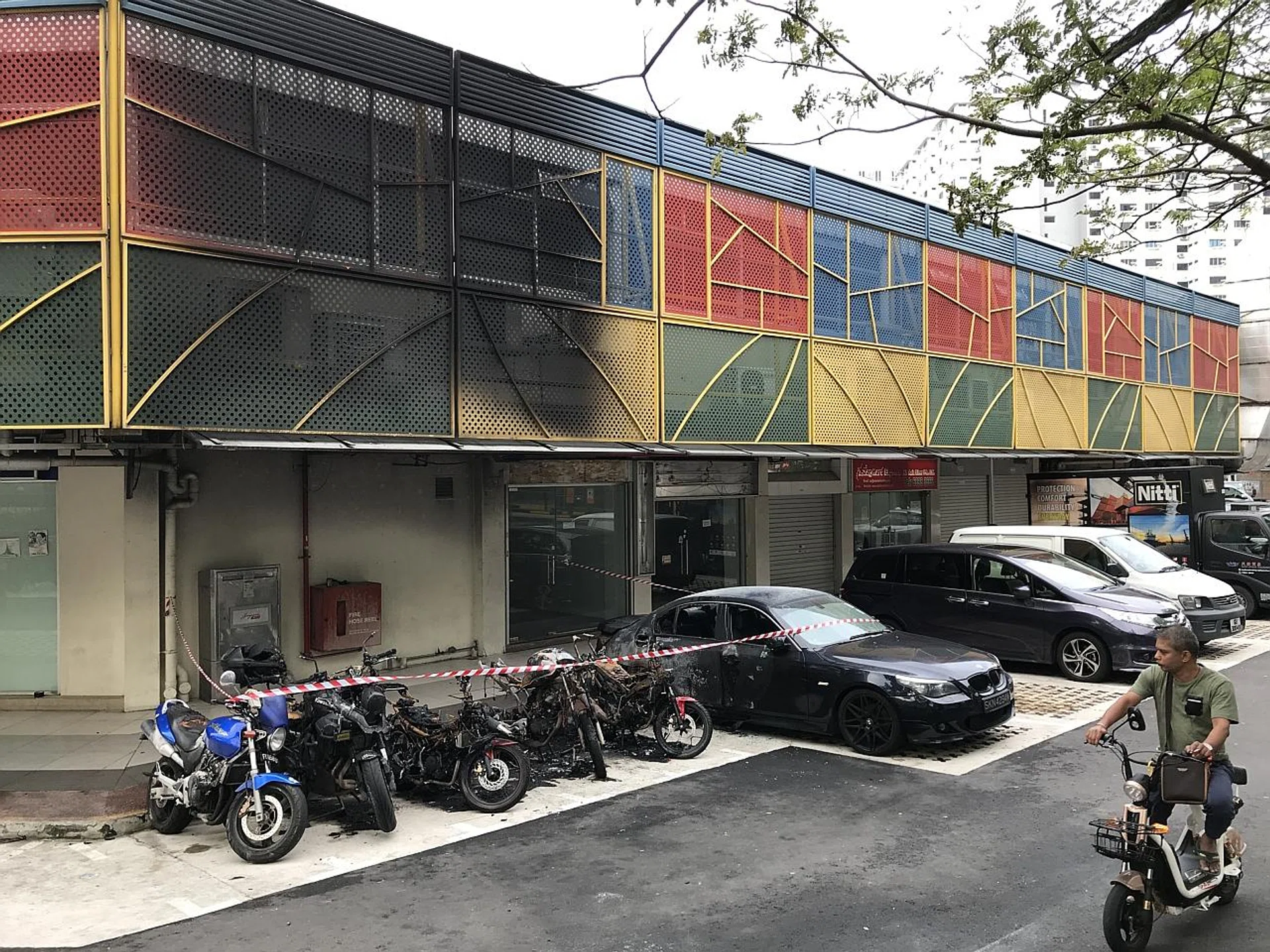 The fire, which damaged multiple vehicles including a BMW car, caused more than $100,000 in damage. 