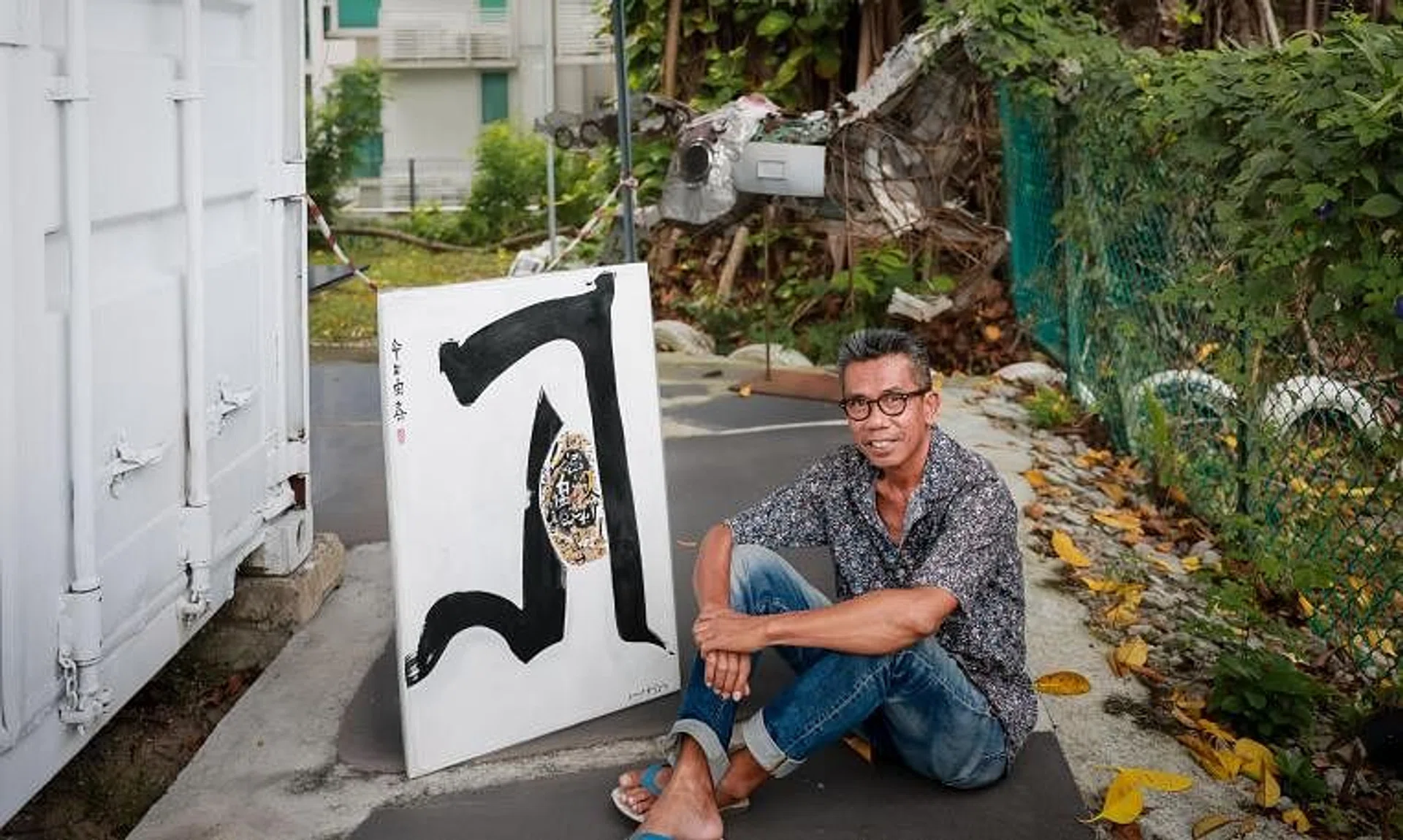 Artist Sunar Sugiyou with his artwork Wiseman (2023) at 11 Upper Wilkie Road, where his studio is located. 