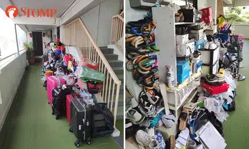 AMK resident struggles to push his wheelchair-bound mother along corridor cluttered with belongings