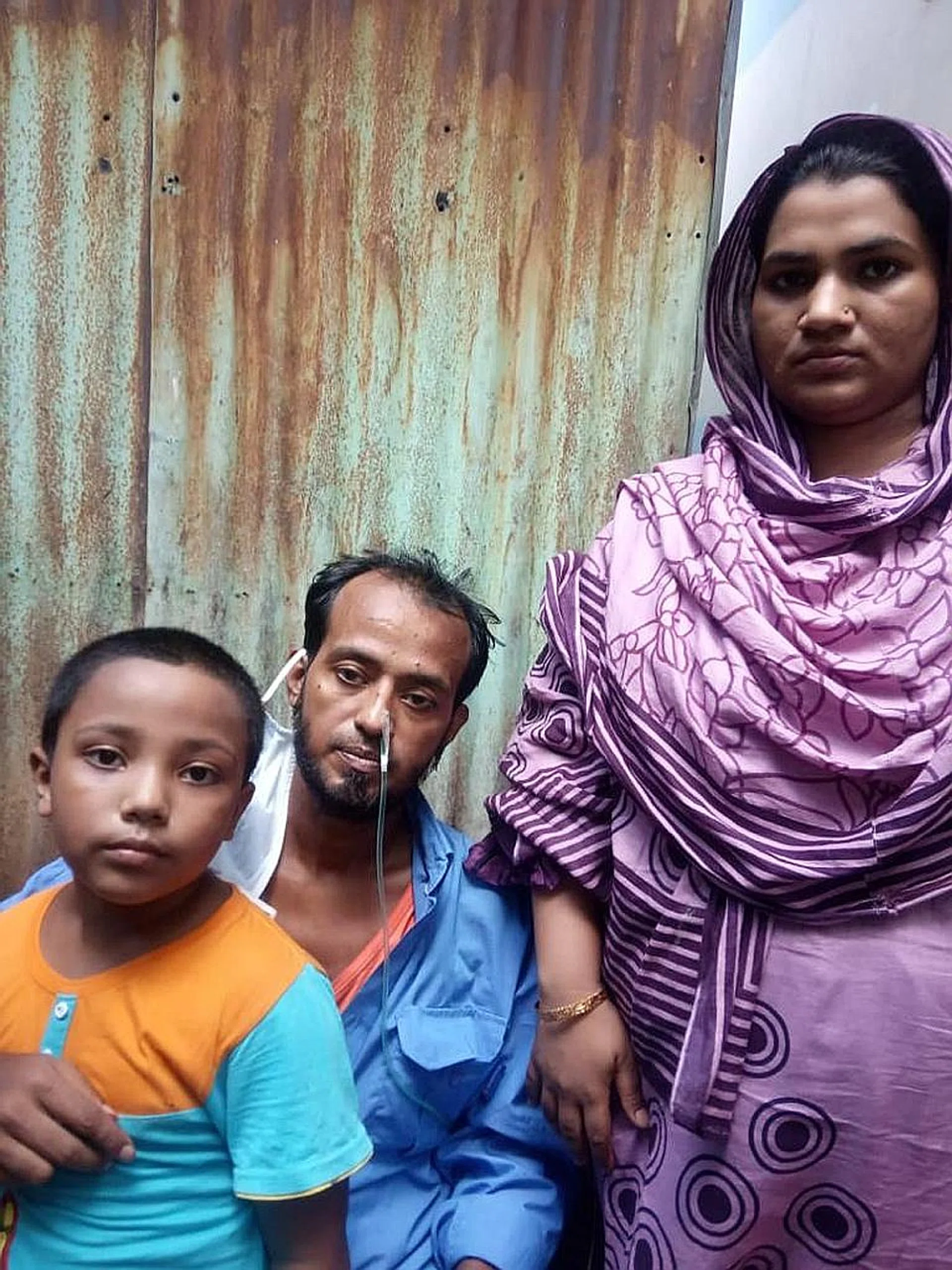 Mr Sikdar Rana, 34, with his wife Moshumi Akhter, 27, and six-year-old son Mahim. He is grateful to everyone who helped him return home to Bangladesh. 