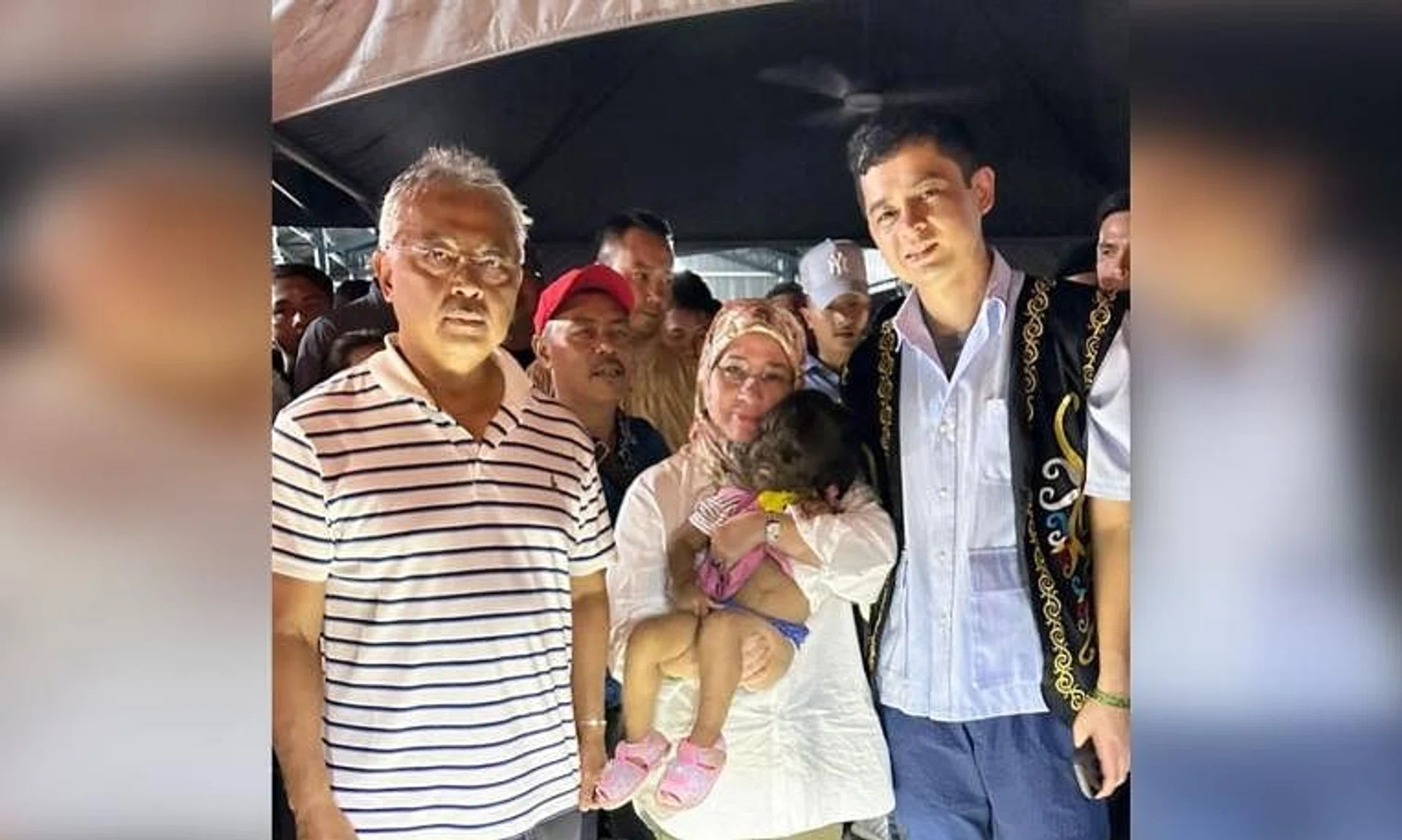 (From left) Sultan Abdullah Ahmad Shah; his wife, Tunku Azizah Aminah Maimunah Iskandariah; and Pahang Regent, Tengku Hassanal Ibrahim Alam Shah, with two-year-old Missclyen Roland.