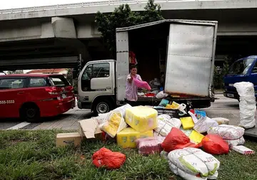 Taxi, lorries collide