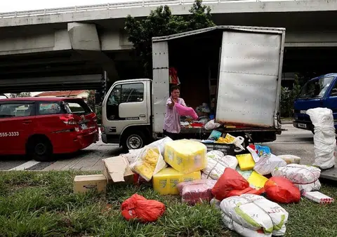 Taxi, lorries collide