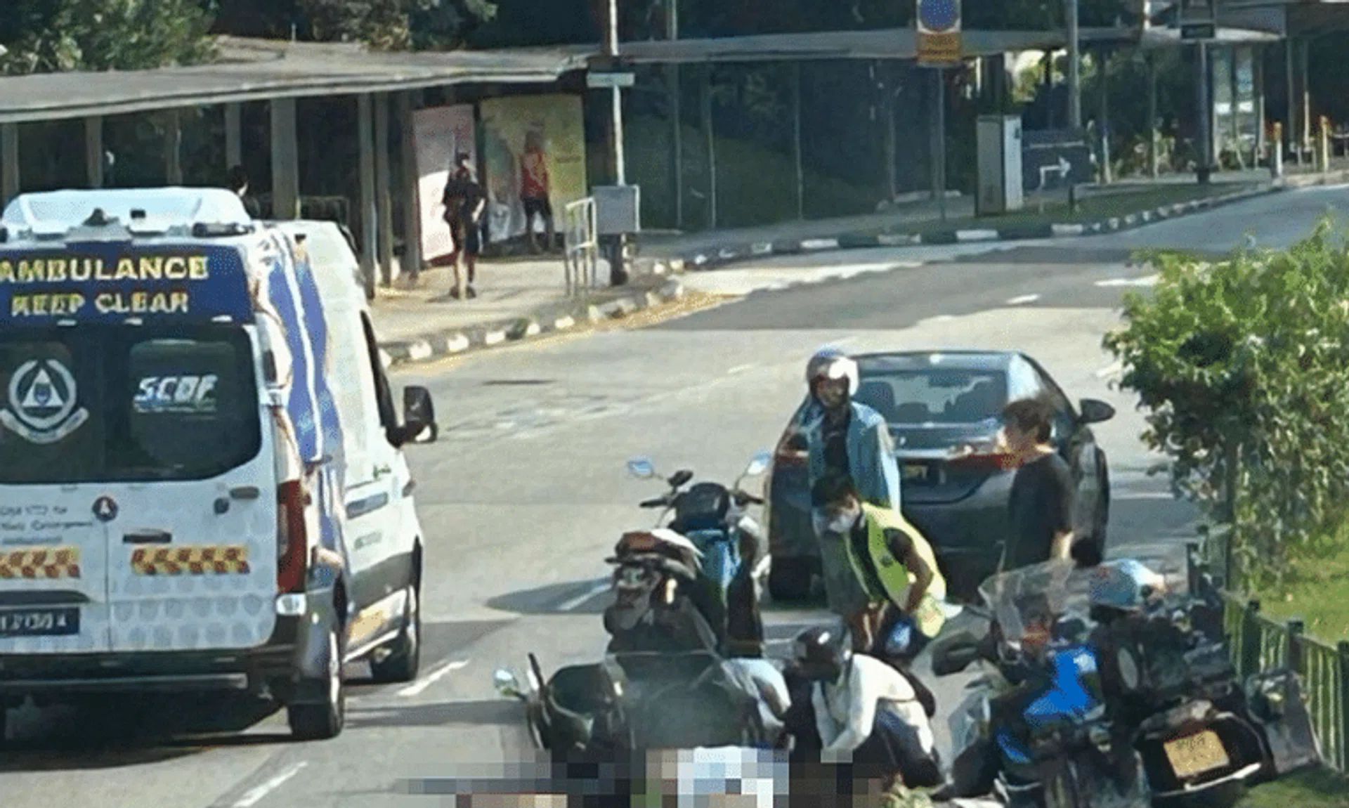 In photos of the aftermath of the accident posted on social media, a man can be seen lying on the road next to a fallen motorbike.