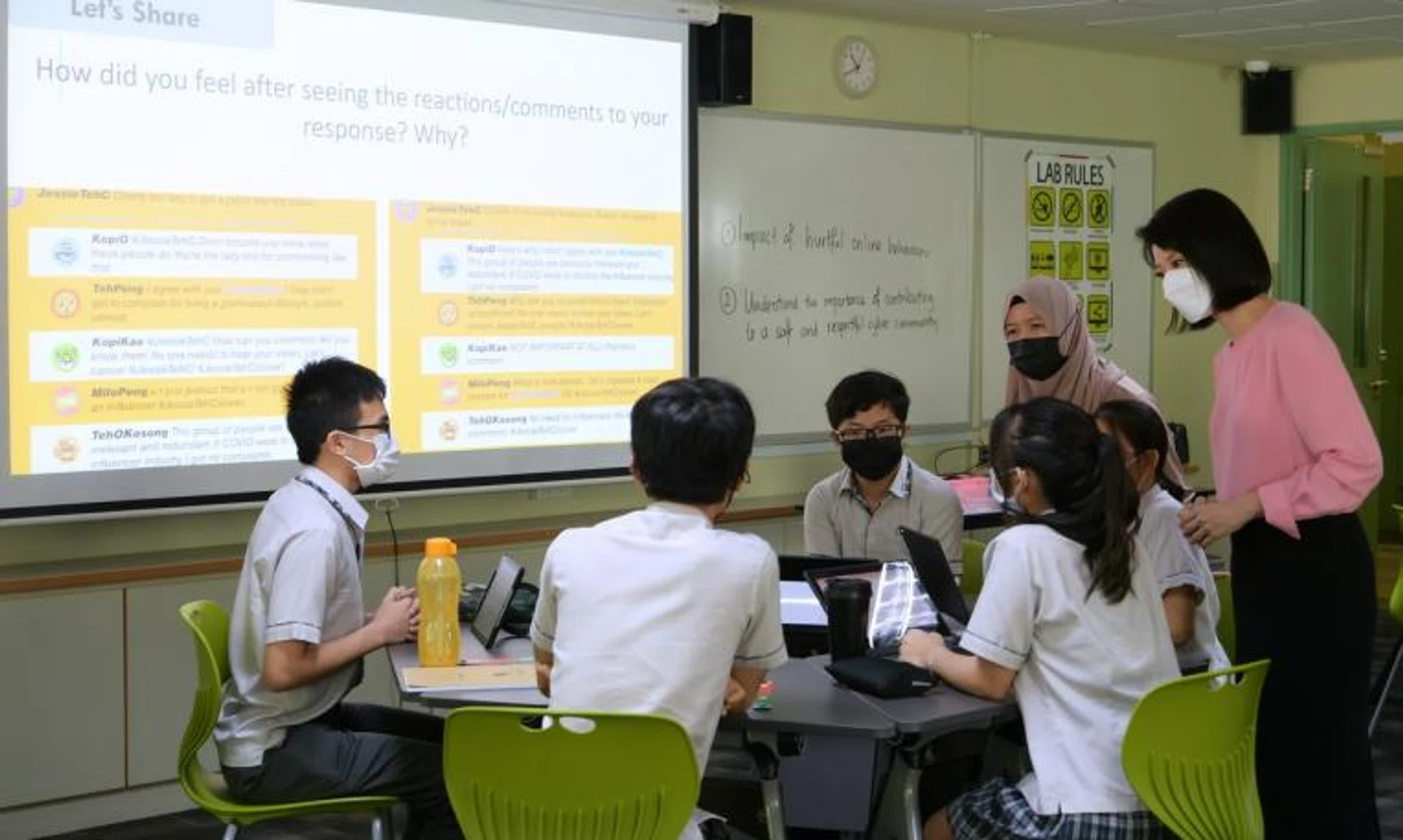 Minister of State for Education Sun Xueling (right) observing a cyber-wellness lesson at Compassvale Secondary School on Jan 18, 2022.