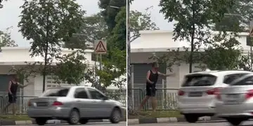 Man filmed throwing stones at cars along Simei Avenue, across from CGH