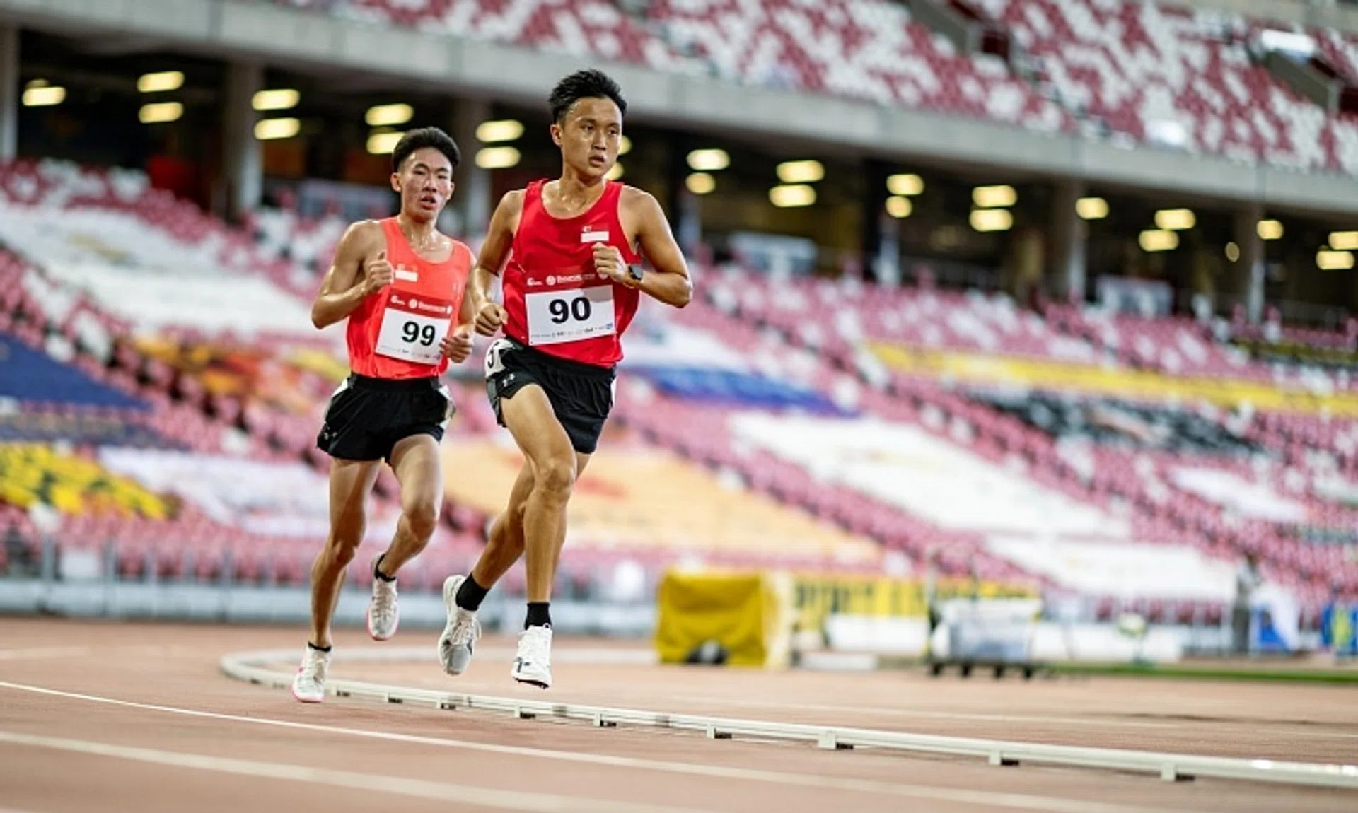 National runner Shaun Goh (right) broke the national record for the 10km road race at the Run Prix in Melbourne on Sept 22.