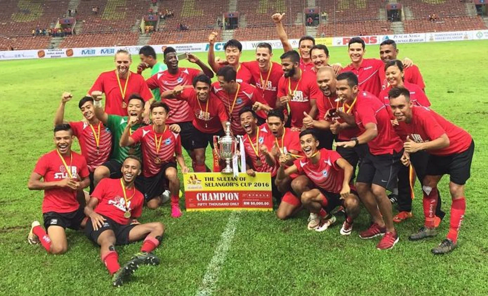 NUMERICAL DISADVANTAGE:  The Singapore Selection (above) are winners despite playing most of the second half a man down.