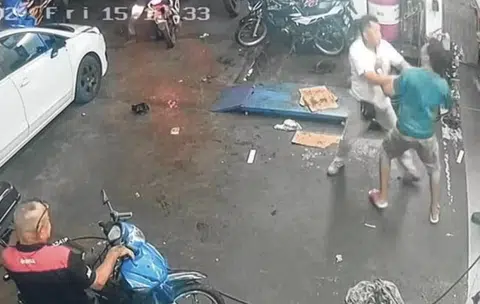 2 men allegedly fight from outside to inside car workshop