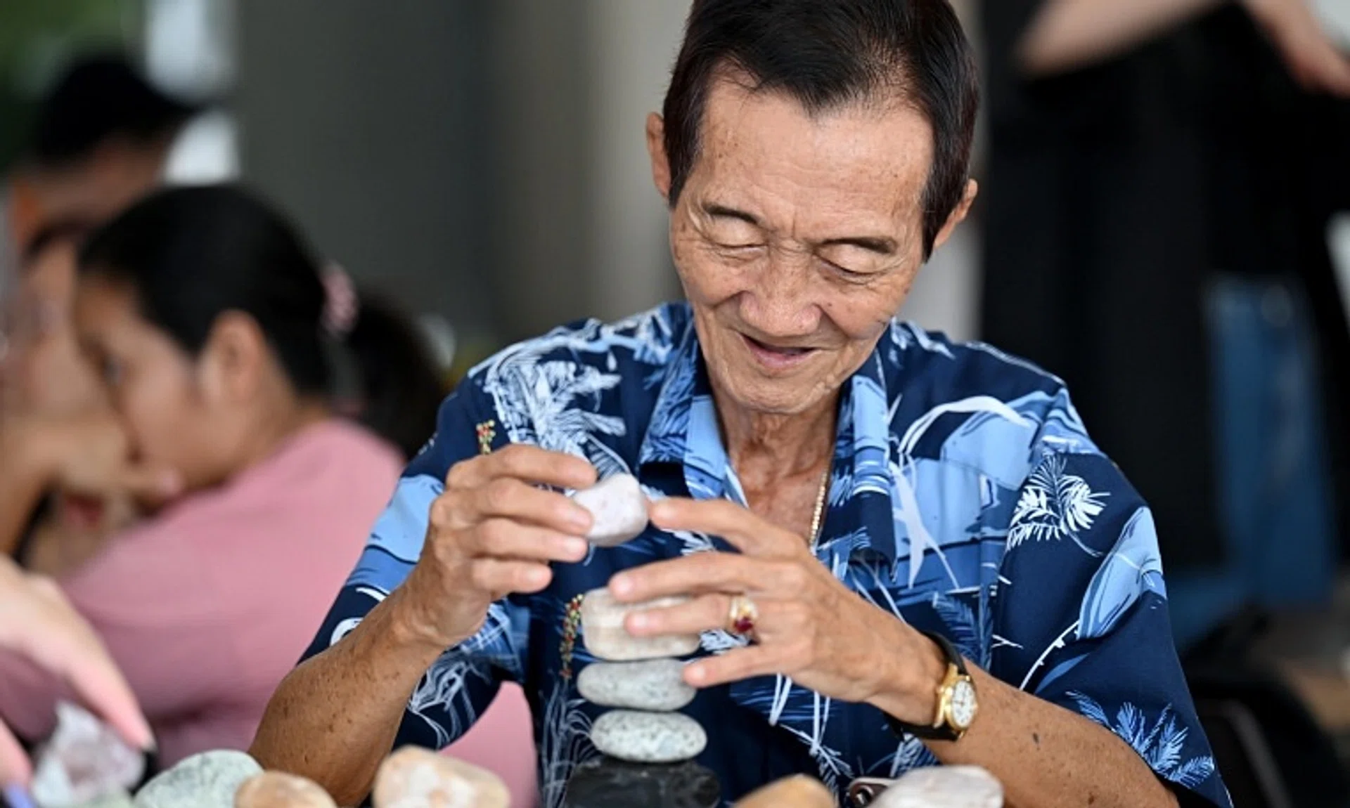 Mr Foo Hwee Wan, 77, has discovered his hidden talent in stone stacking since he met the students.