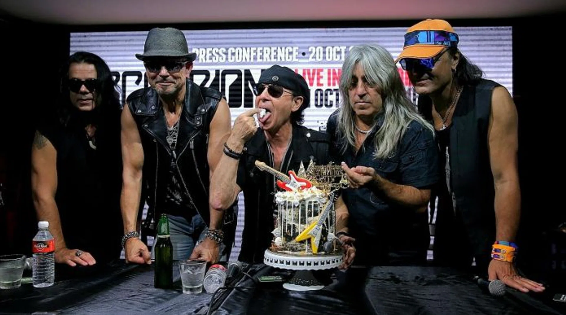 ROCKERS: German band Scorpions, comprising (from left) bassist Paweł Maciwoda, guitarist Rudolf Schenker, vocalist Klaus Meine, drummer Micael Delaoglou, and rhythm guitarist Matthias Jabs, celebrating their 50th anniversary with a cake.