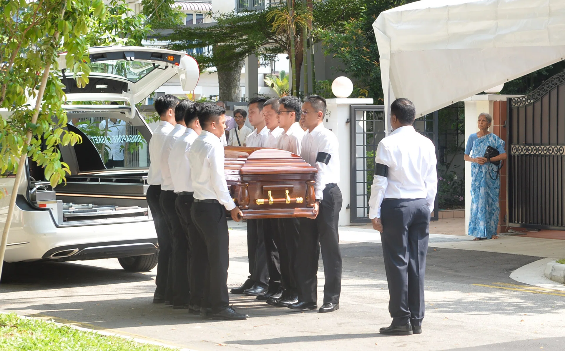 Mr S R Nathan's casket arriving at his home at Ceylon Road.