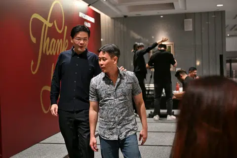 PM Lawrence Wong (left) with two-term MP Louis Ng.