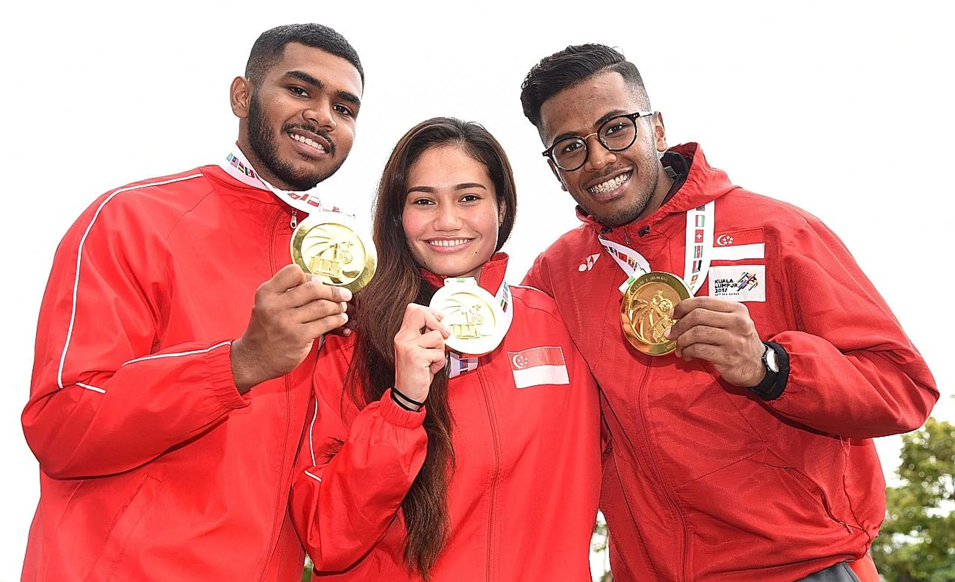 (From left) Sheik Farhan, Nurul Suhaila Mohd Saiful and Sheik Ferdous with their gold medals. 
