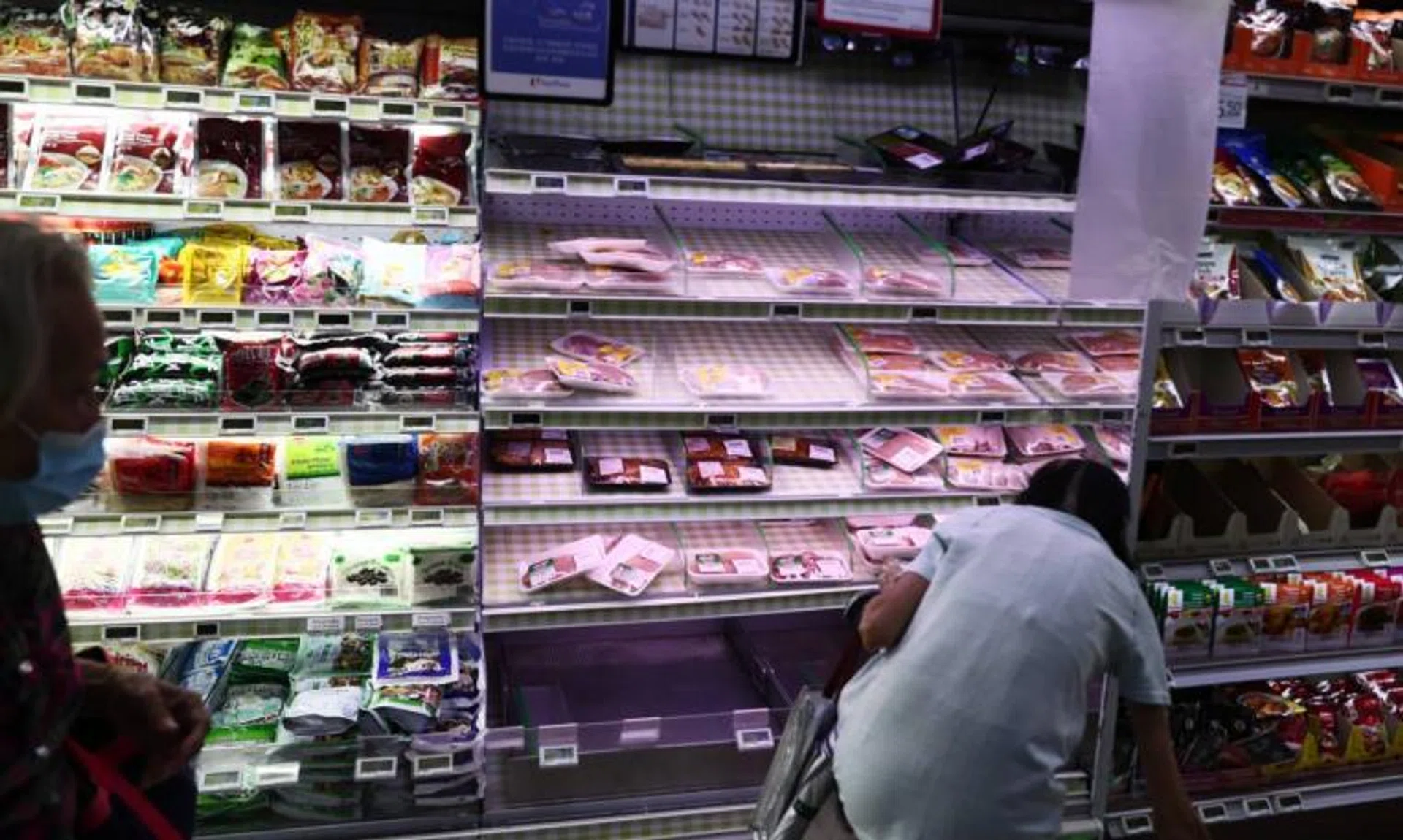 Stocks of chicken is seen becoming lesser at Fairprice Chinatown Point on May 25, 2022.