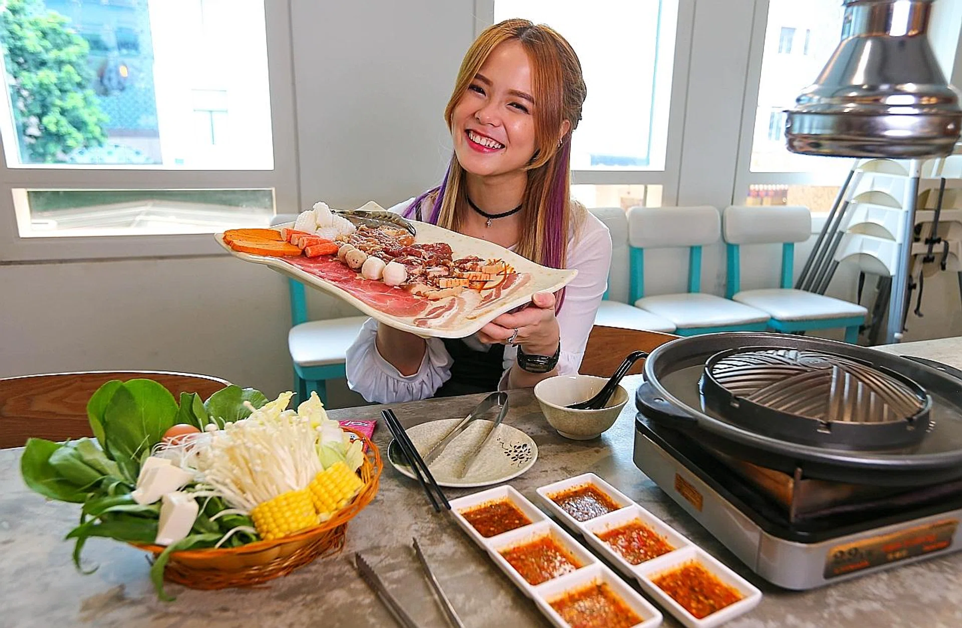 Local actress Hayley Woo at Mookata in Bugis Junction.