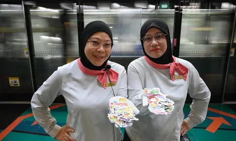 MRT 'sticker aunties' bring smiles to kids on morning commute
