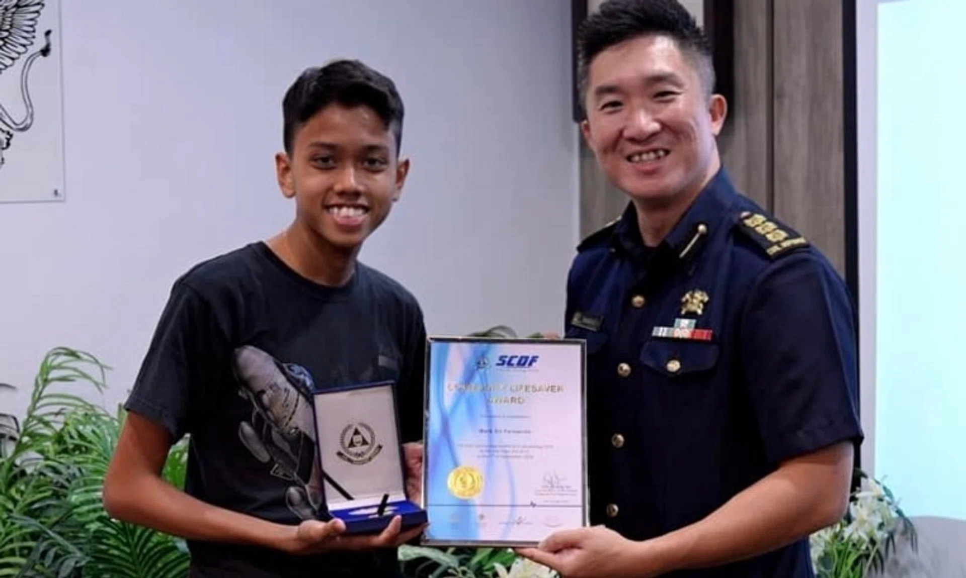 Mark Eli Fernando (left), 15, helped a man in a cardiac arrest incident after he was alerted to it on Sept 7 by the Singapore Civil Defence Force's app.