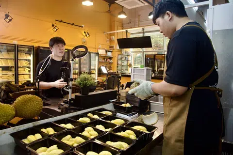 The Vlack Durian team takes turns to live stream its durians on TikTok Shop.