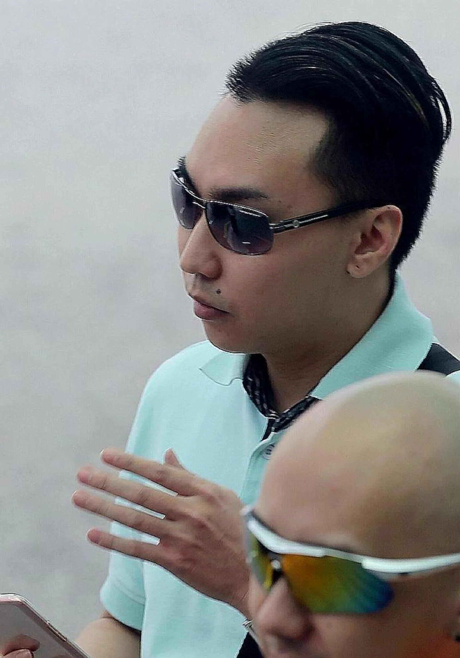 GUILTY: The girlfriend of Franklie Tan Guang Wei (above), who was last week jailed six and a half years' and given six strokes of the cane for abusing her son, yesterday pleaded guilty to two charges of letting him do so.