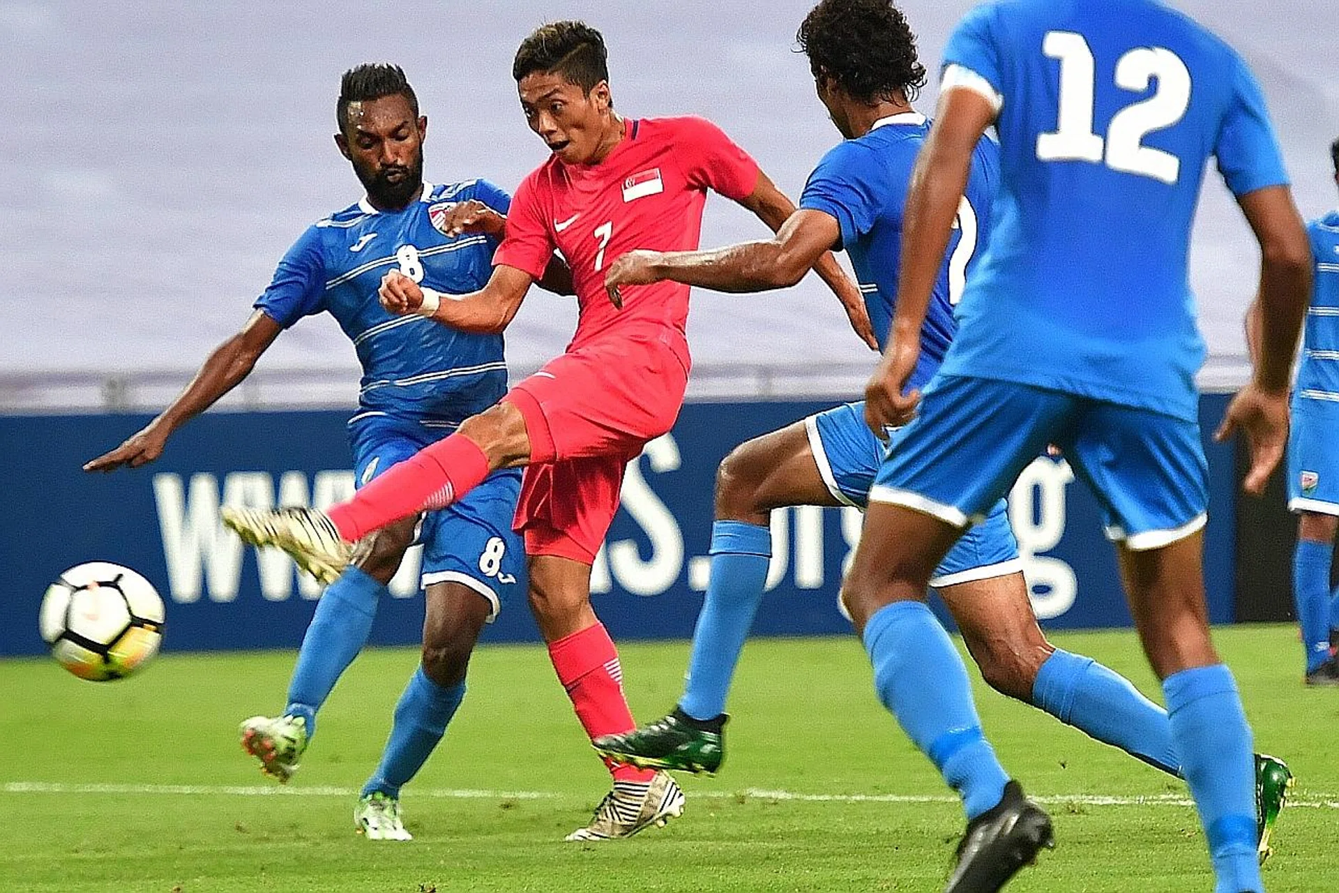 Singapore's Shawal Anuar attempting a shot against the Maldives last Friday. 