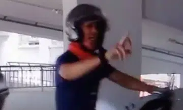Rider apologises for flashing middle finger at driver