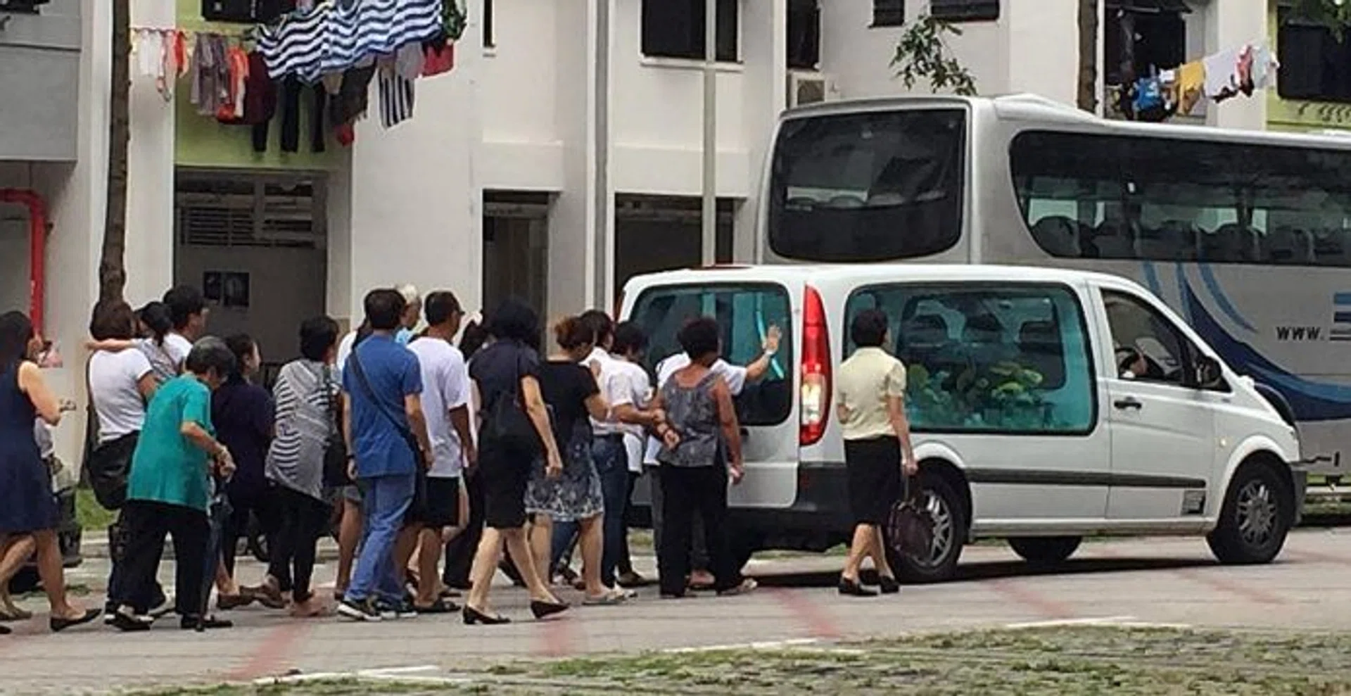 GRIEF AND TRAUMA: (Above) The funeral procession for Madam Lau. 