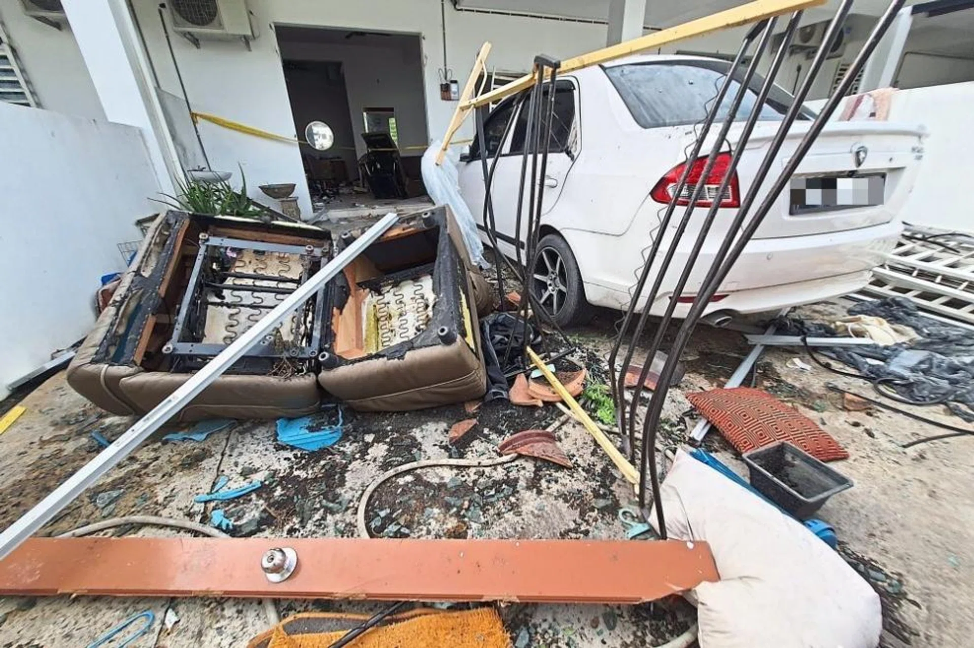 Debris at the front of the house after the explosion in Taman Sena Permai, Pokok Sena, Penang.