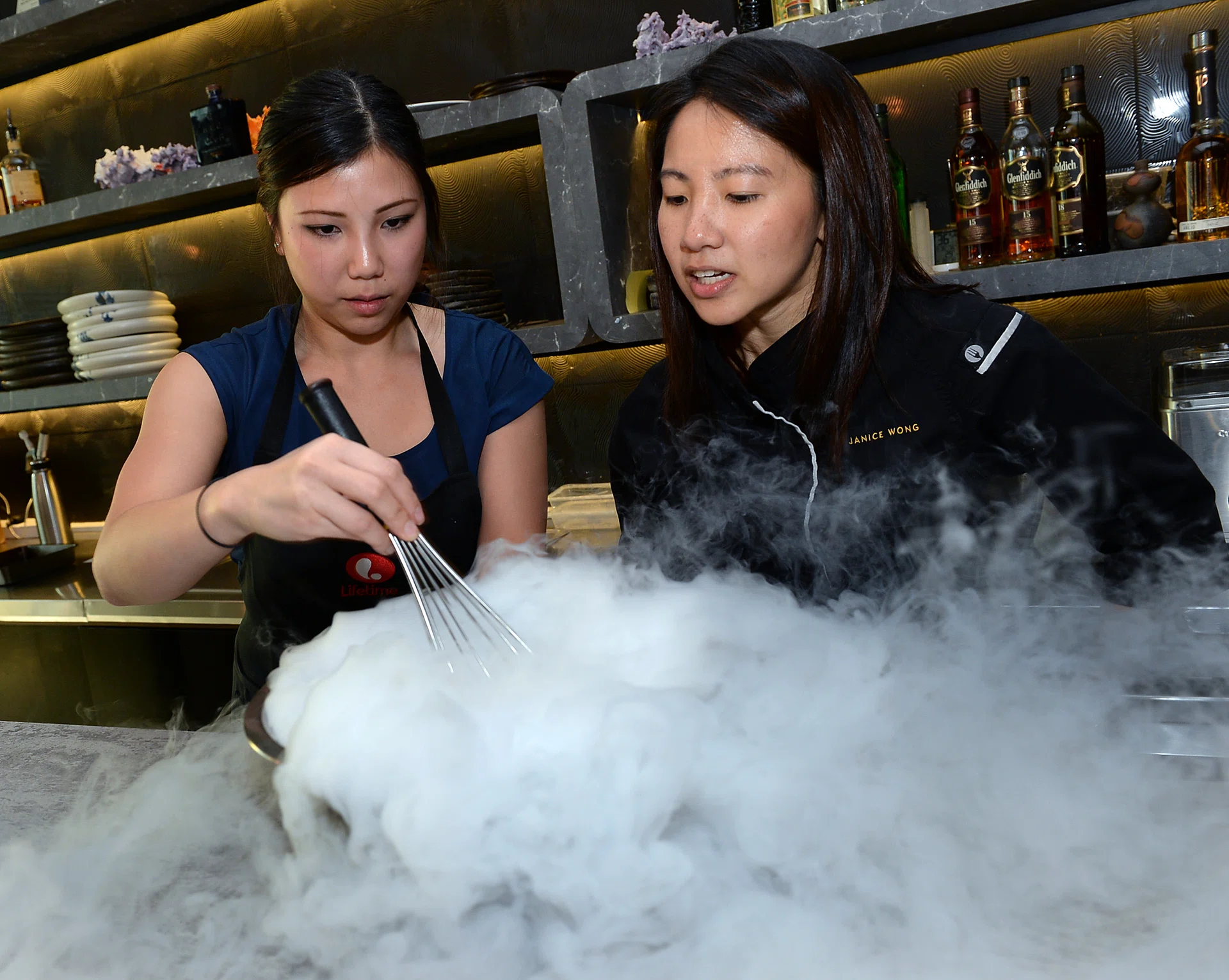 COOL: Masterchef Australia Season 8 contestant Karmen Lu (left) and local pastry chef Janice Wong create whisky ice cream.
