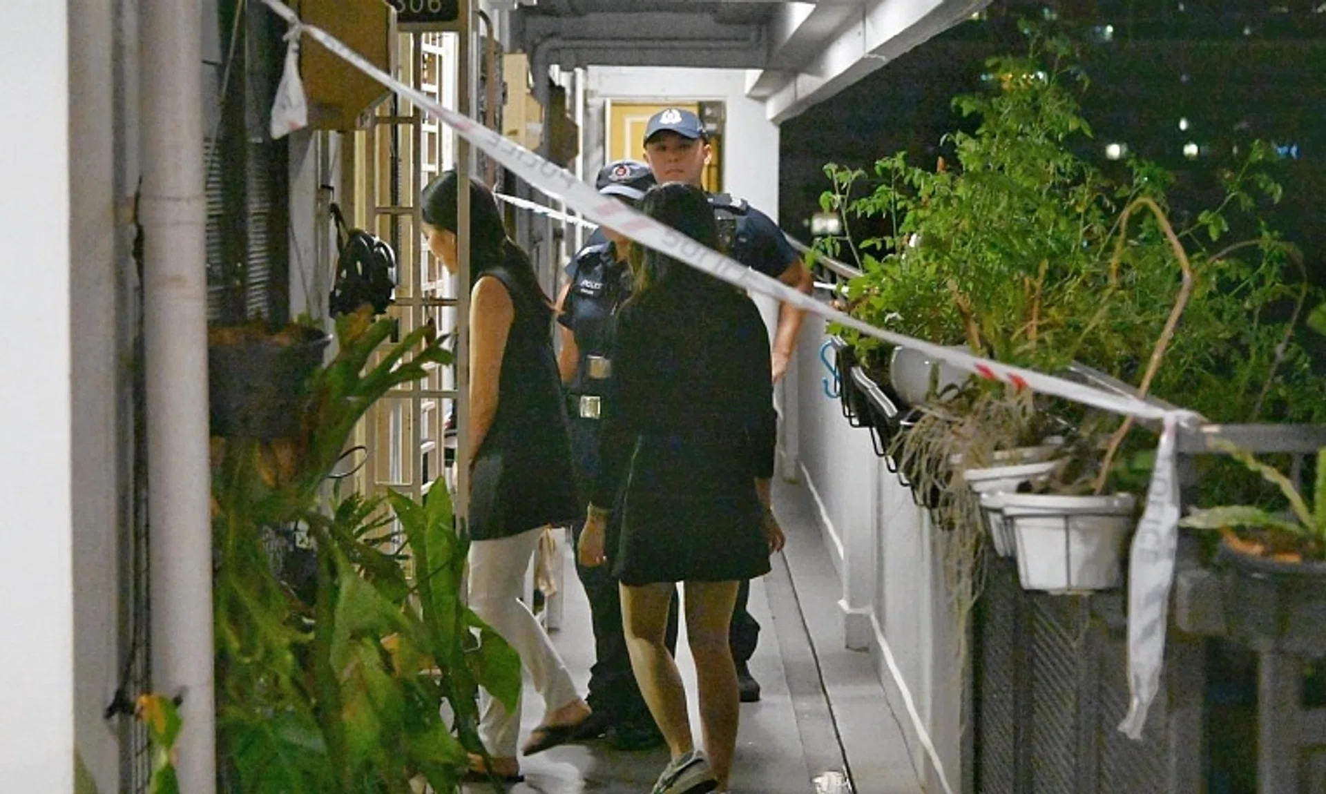 The body of a woman was found inside an 11th-floor flat at Block 1 Dover Road on Dec 2.