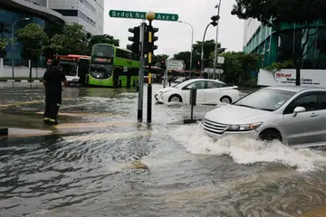 What should motorists and residents do in case of a flash flood?
