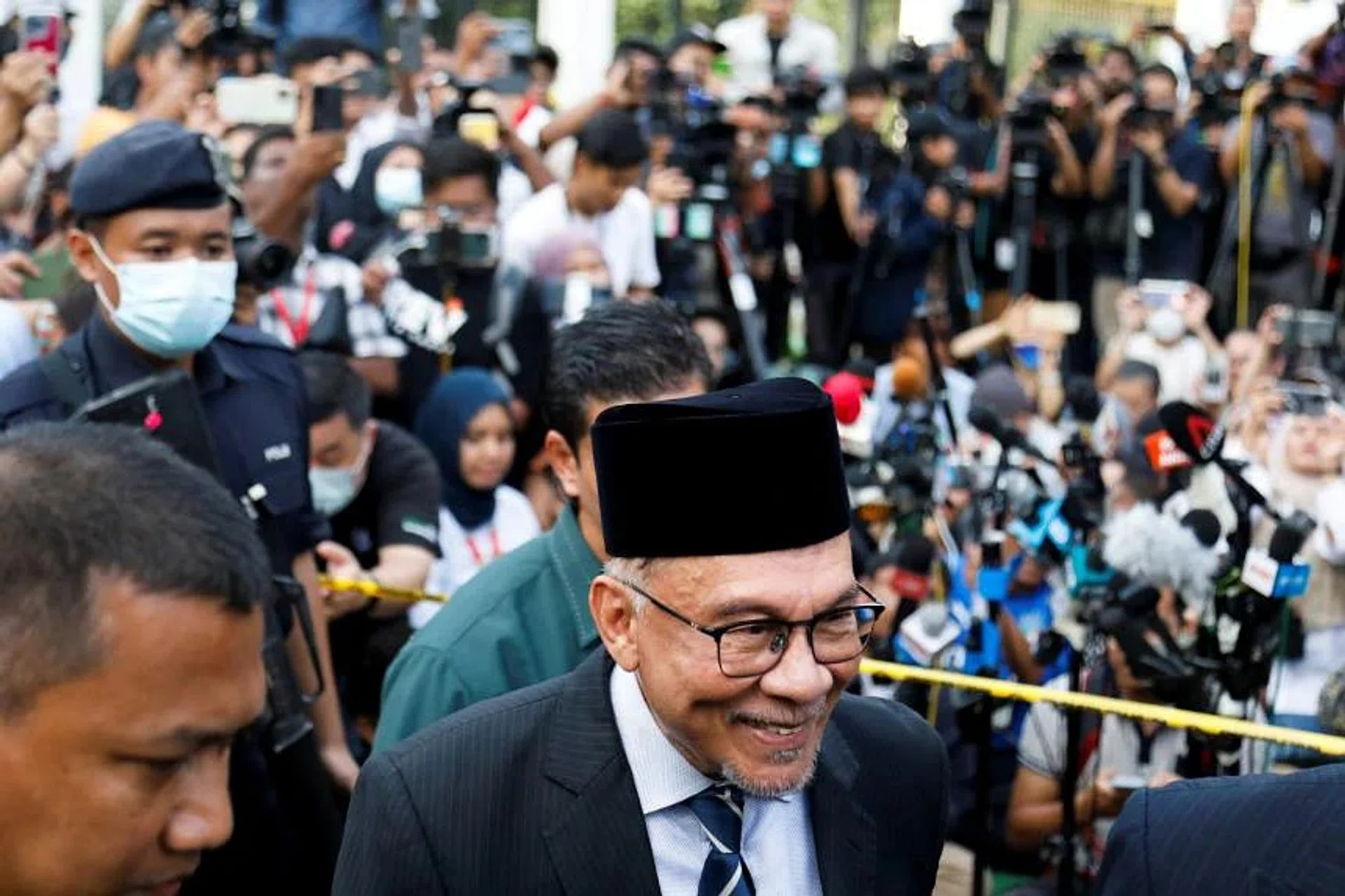 Malaysia's opposition leader Anwar Ibrahim speaking to the media outside the National Palace in KL on Nov 22, 2022. 