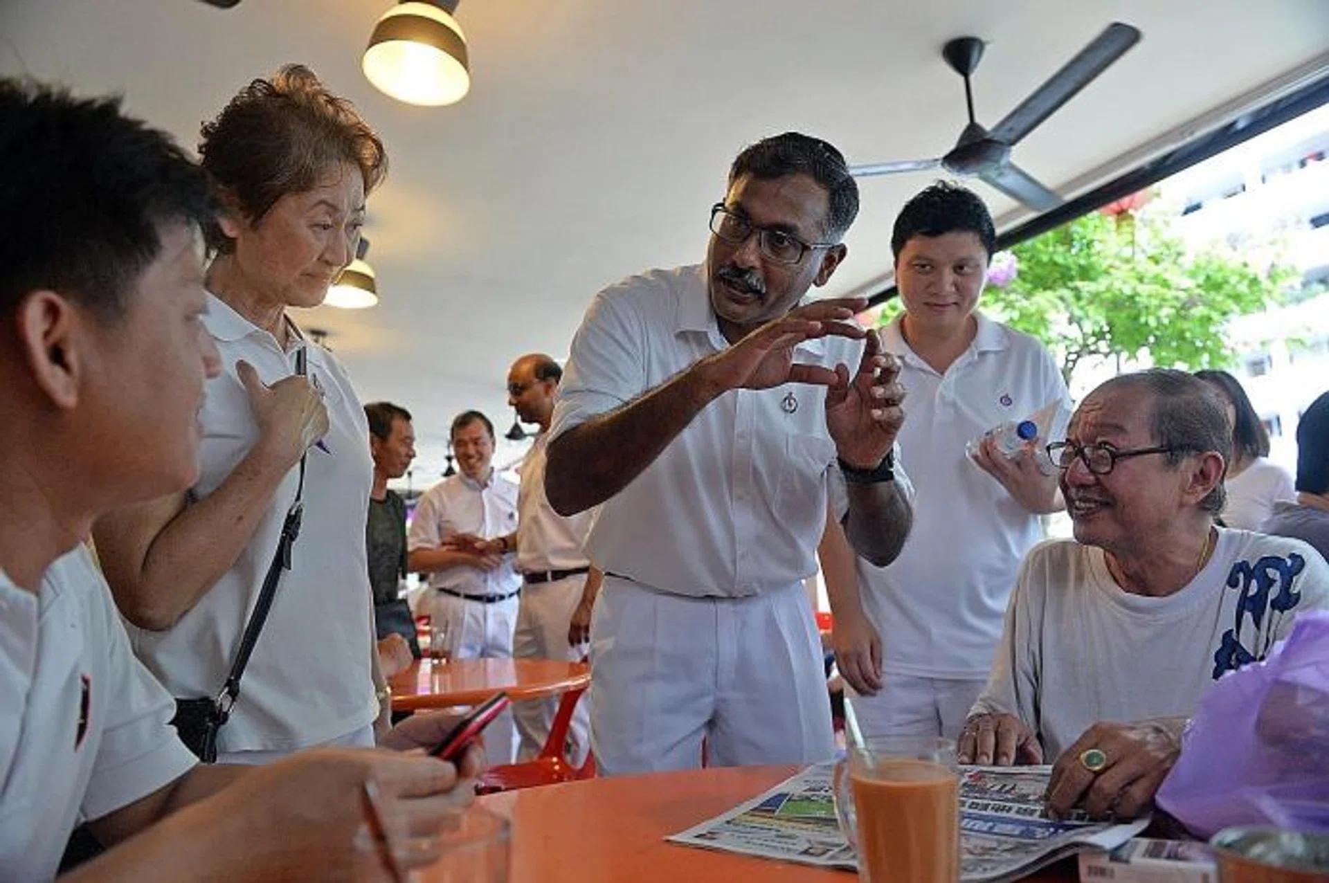 WALKABOUT: (Above) Mr Murali Pillai meeting residents and sharing details of the renewal plans.