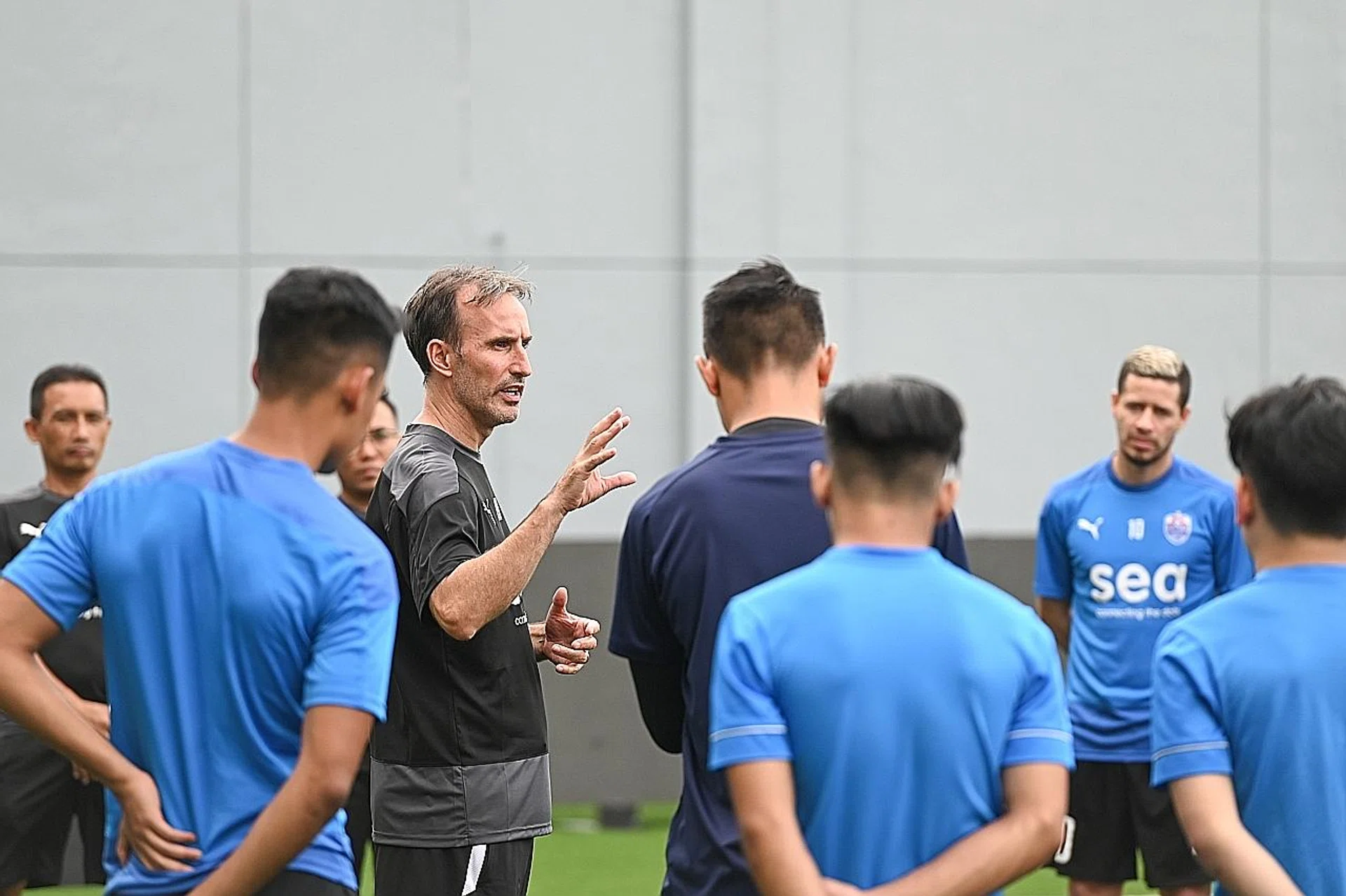 Lion City Sailors coach Aurelio Vidmar (briefing his team) says his players are motivated and competition for places is a "good headache". 